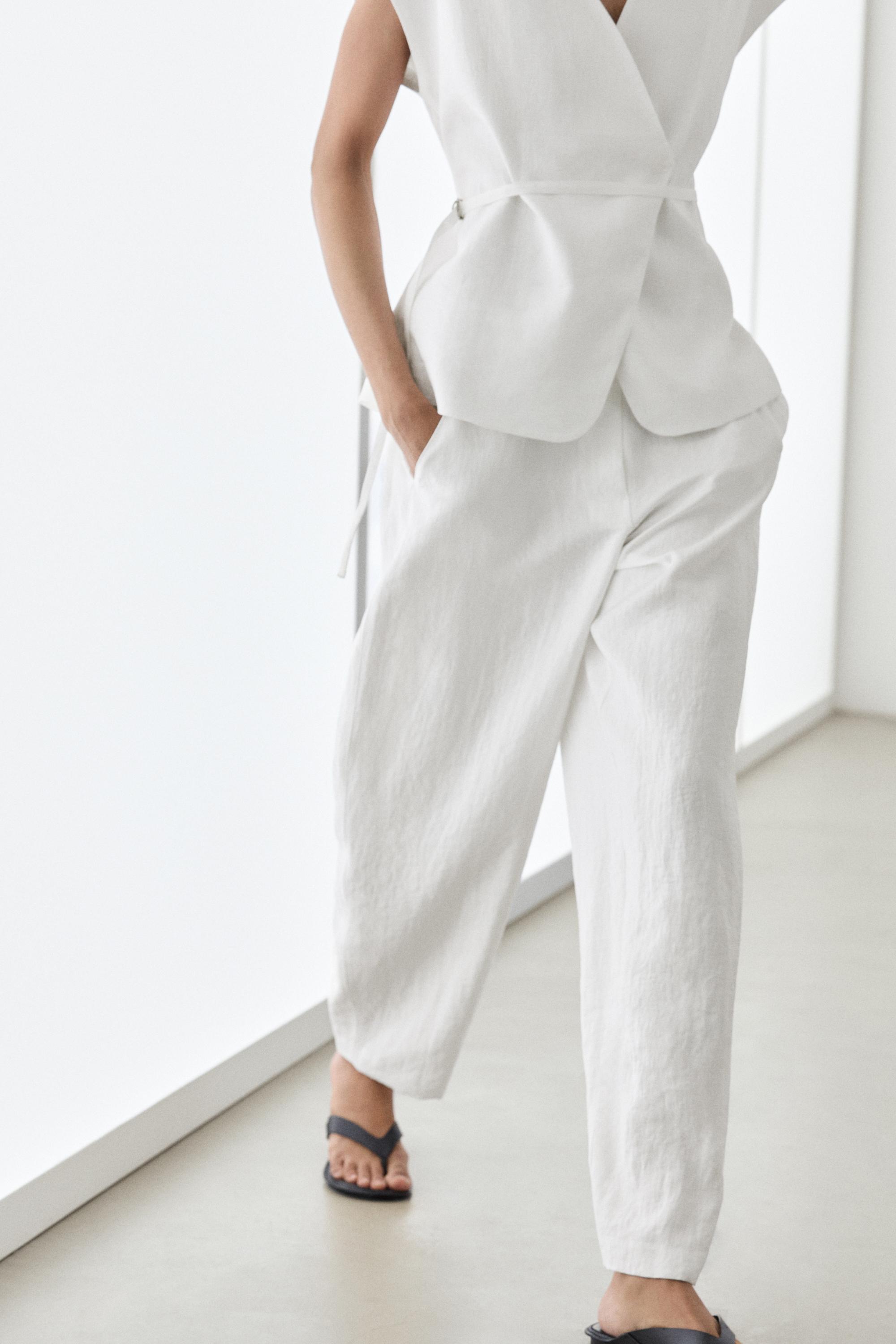 Flowing trousers with buckles — WHITE