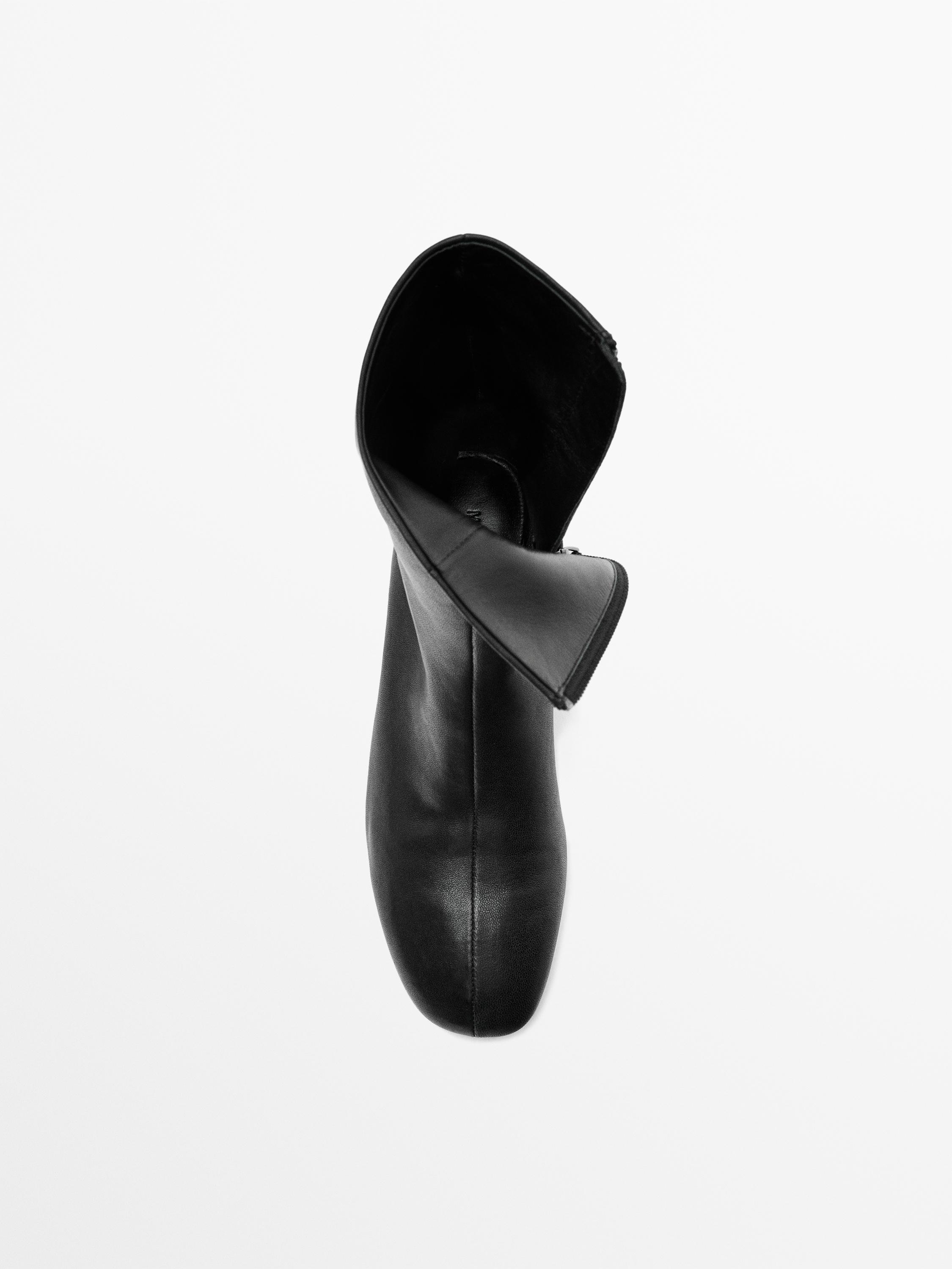 Çizme lëkure me takë të lartë