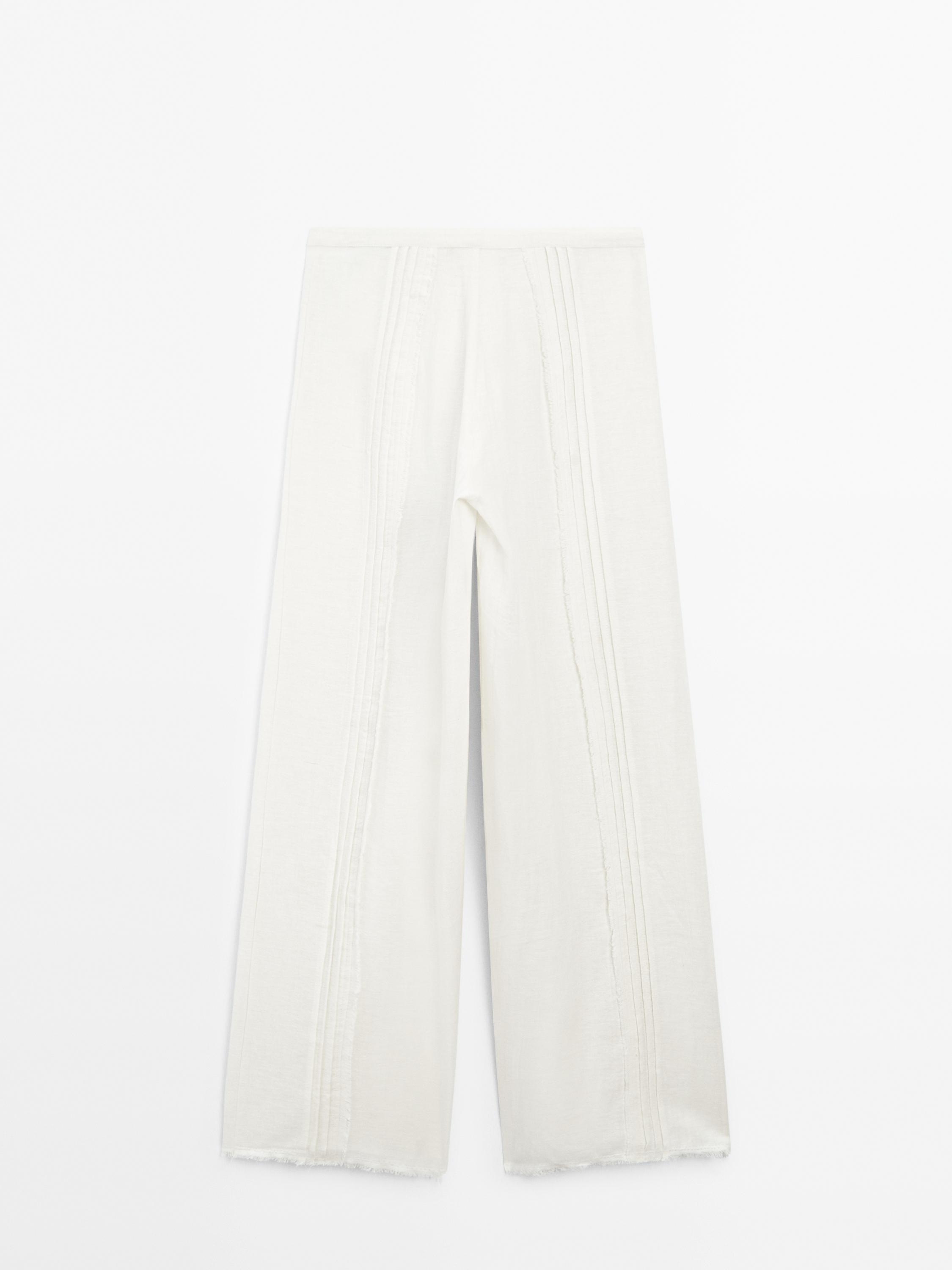 Cotton blend trousers with embroidered details