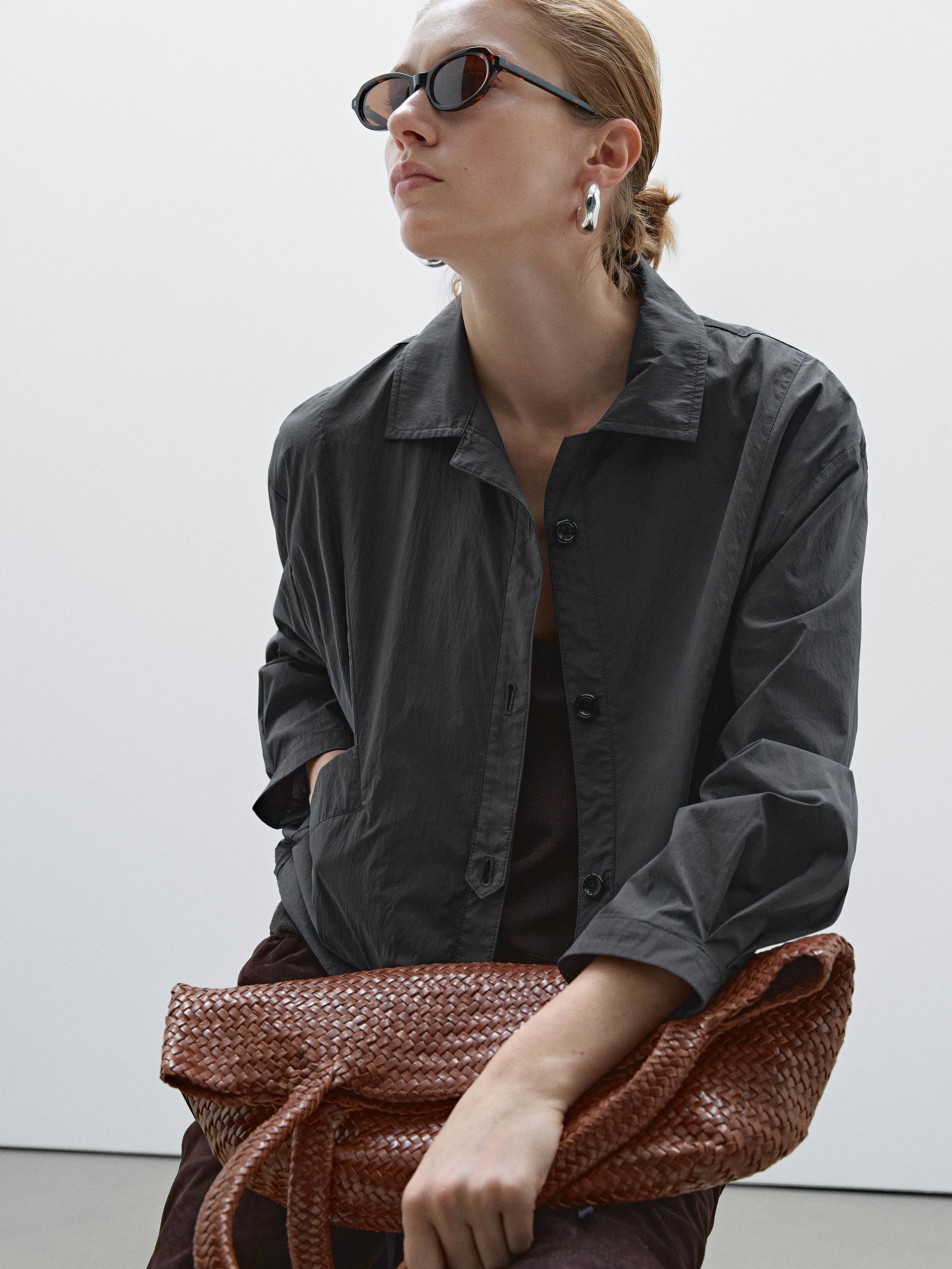 Bomber jacket with seams and gathering