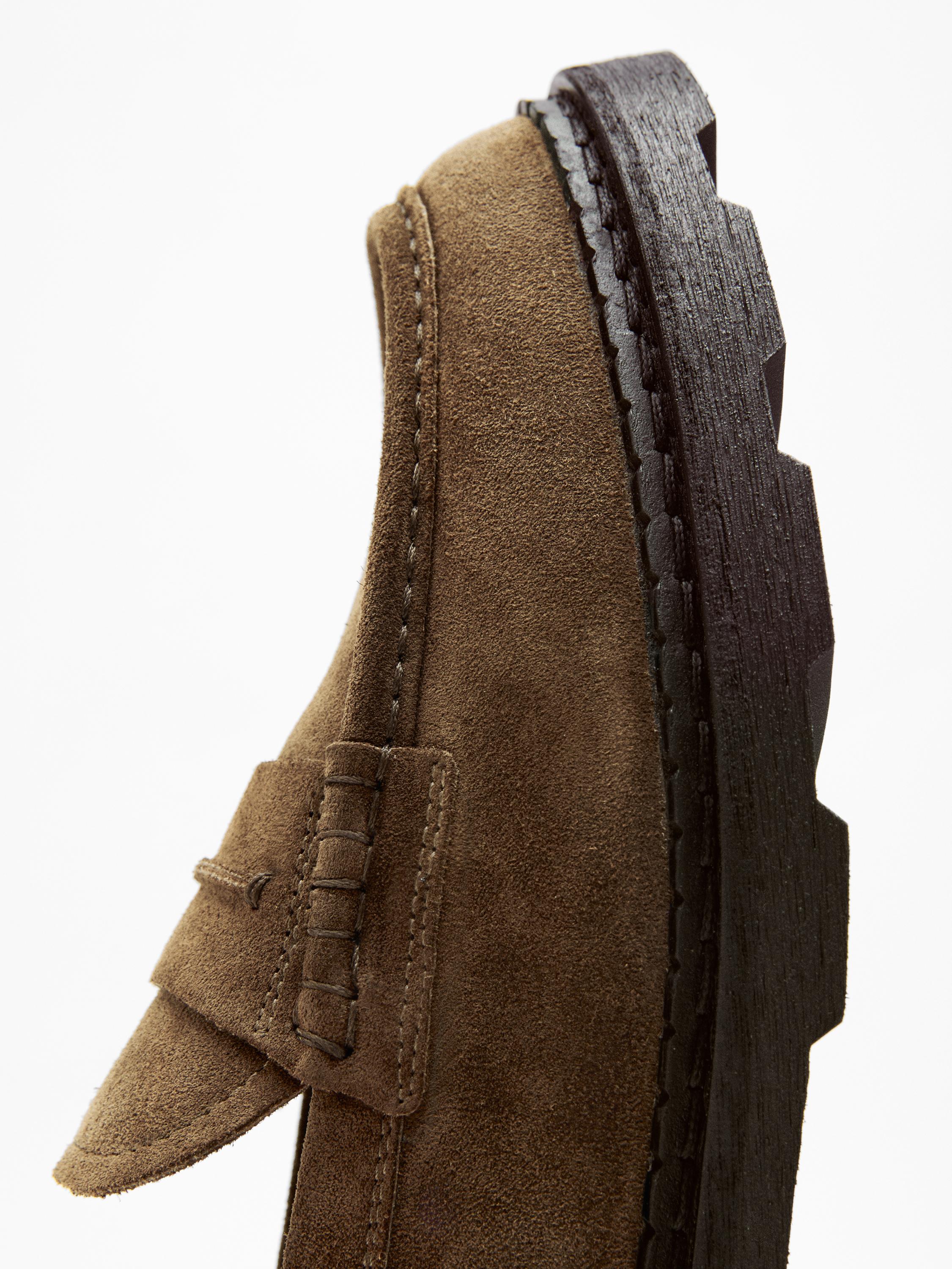Leather track-sole loafers with penny strap — BROWN