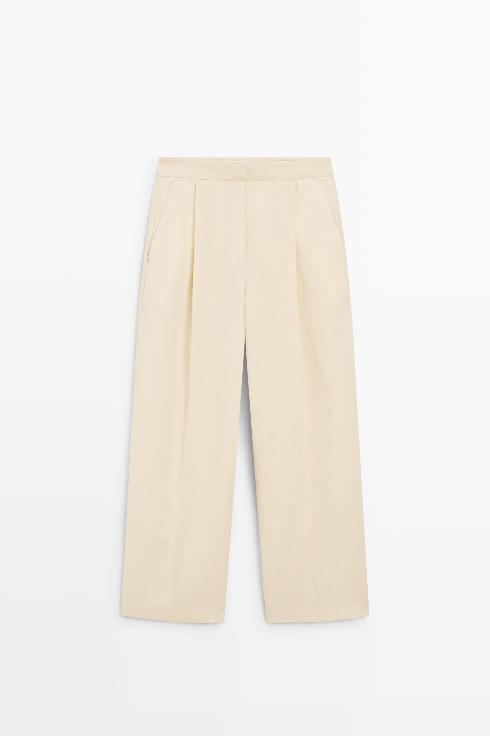 Flowing trousers with pleats — Beige