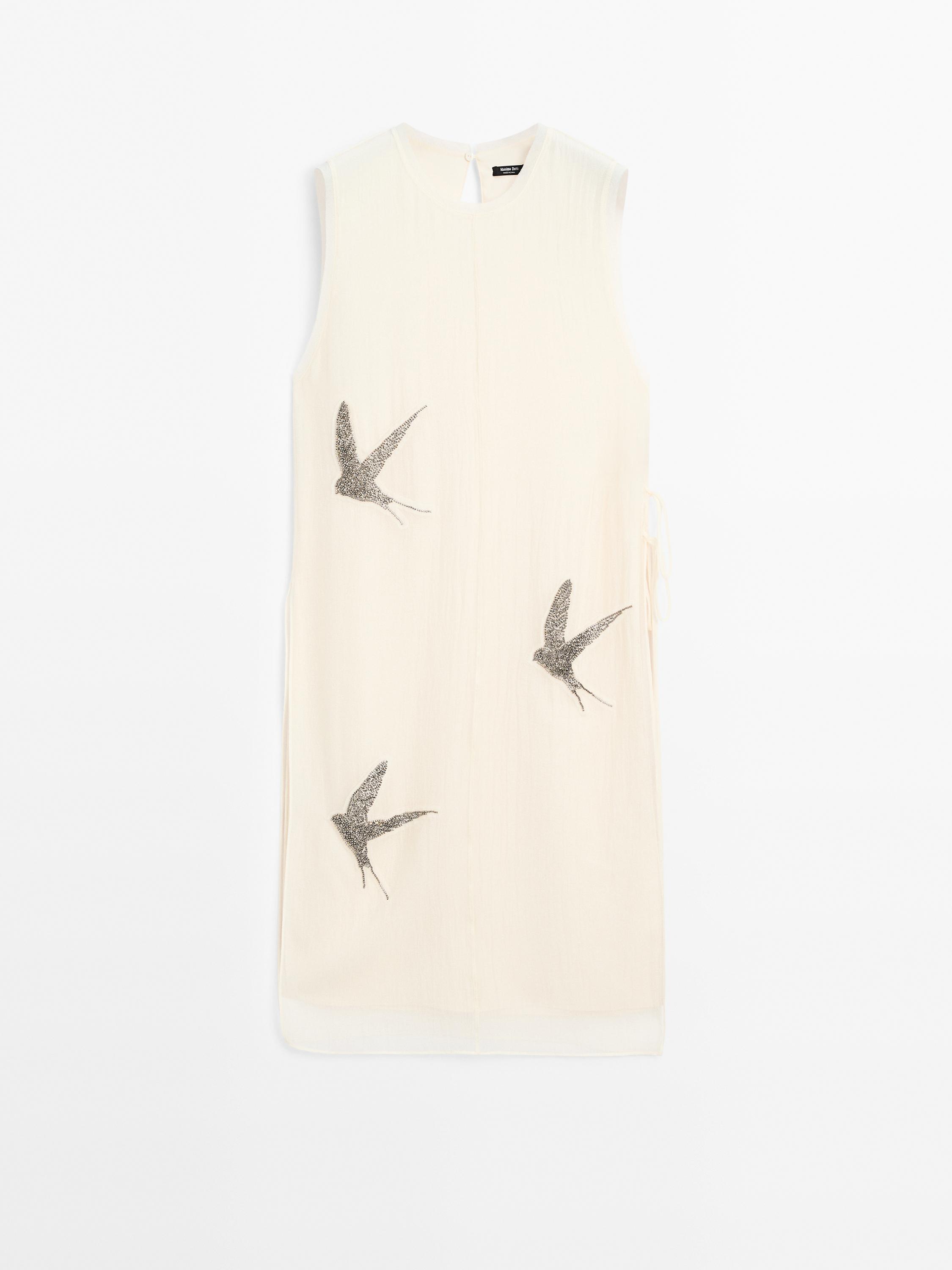 Tunic top with embroidered details