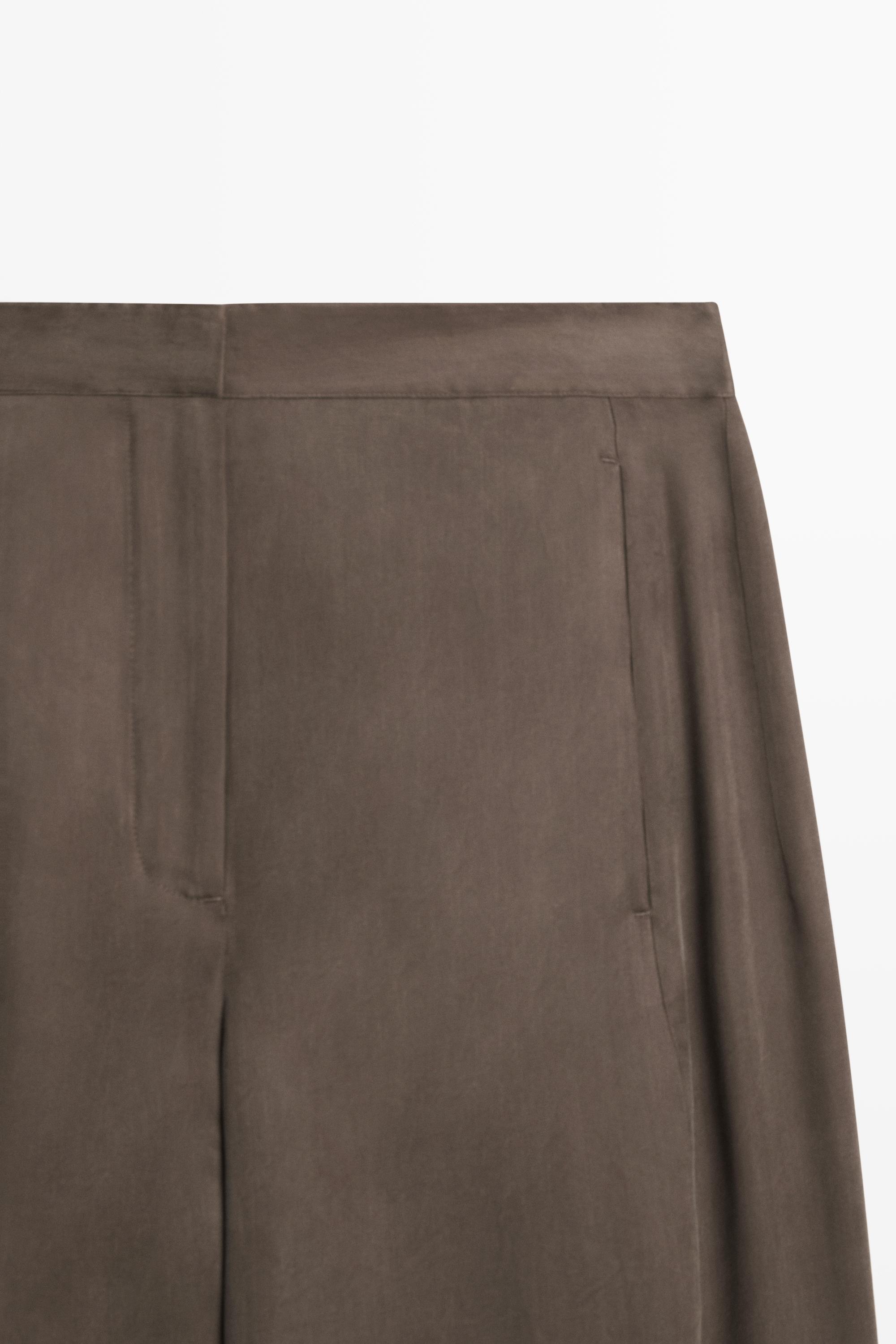 Total look flowing trousers with buttoned hems — PLUM