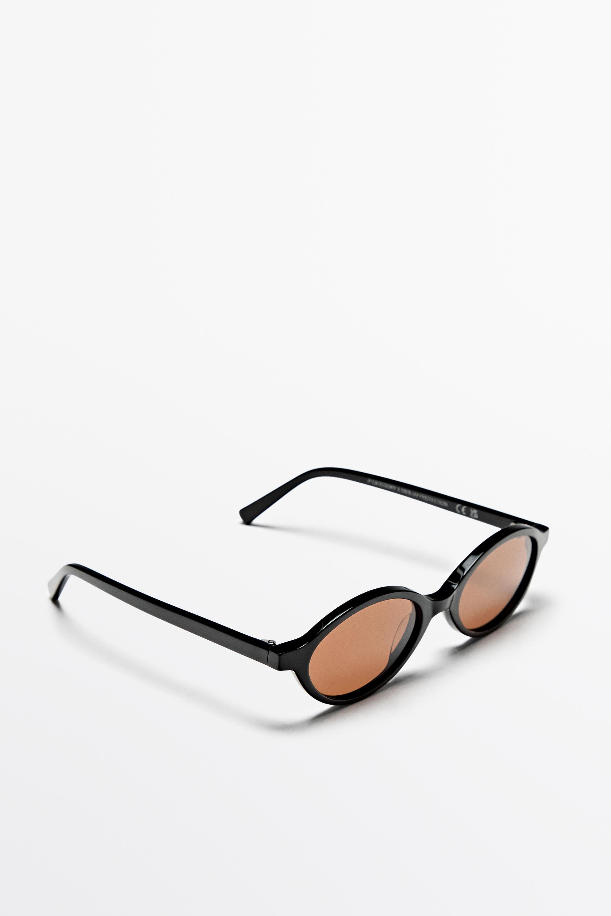 Oval sunglasses — BLACK
