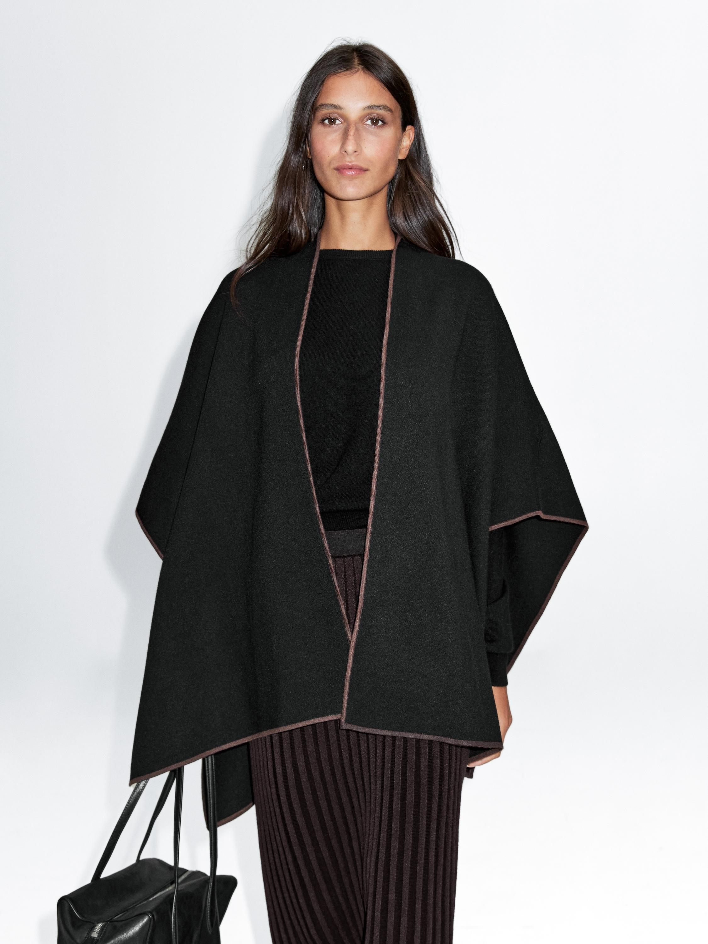 Knit cape with contrast detail