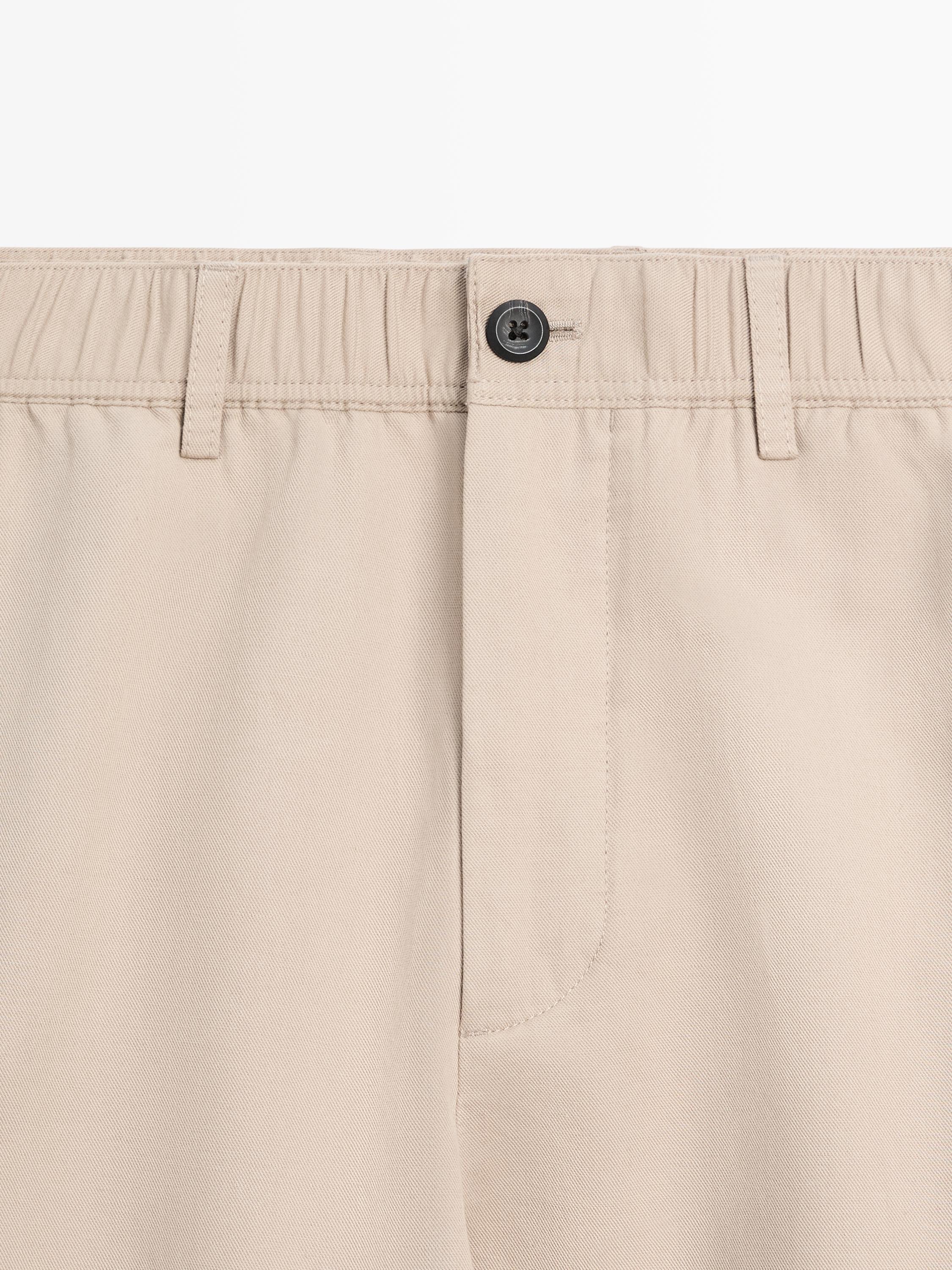 Pantallona pambuku me prerje sportive