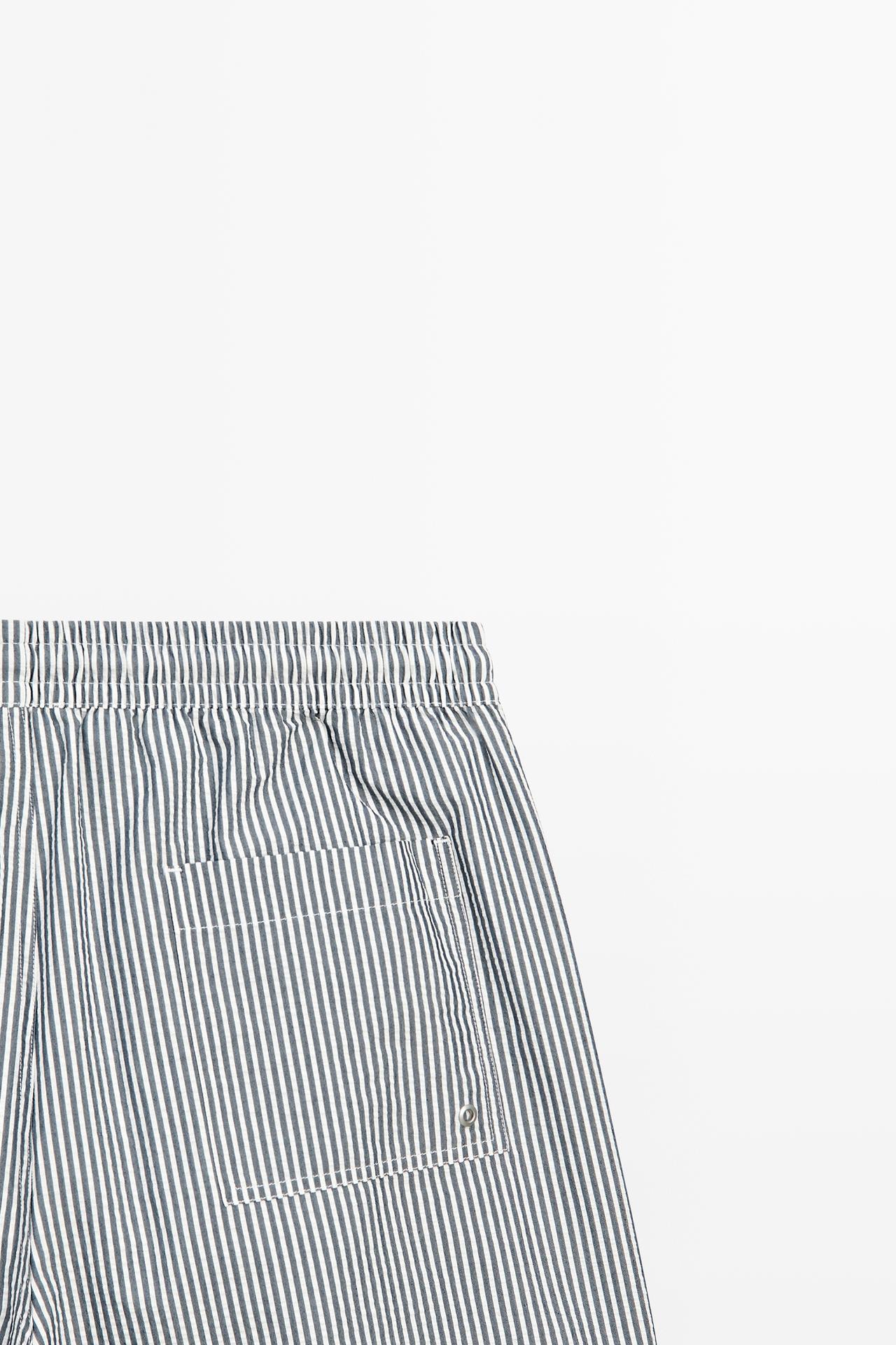 Swimming trunks with striped details — NAVY BLUE