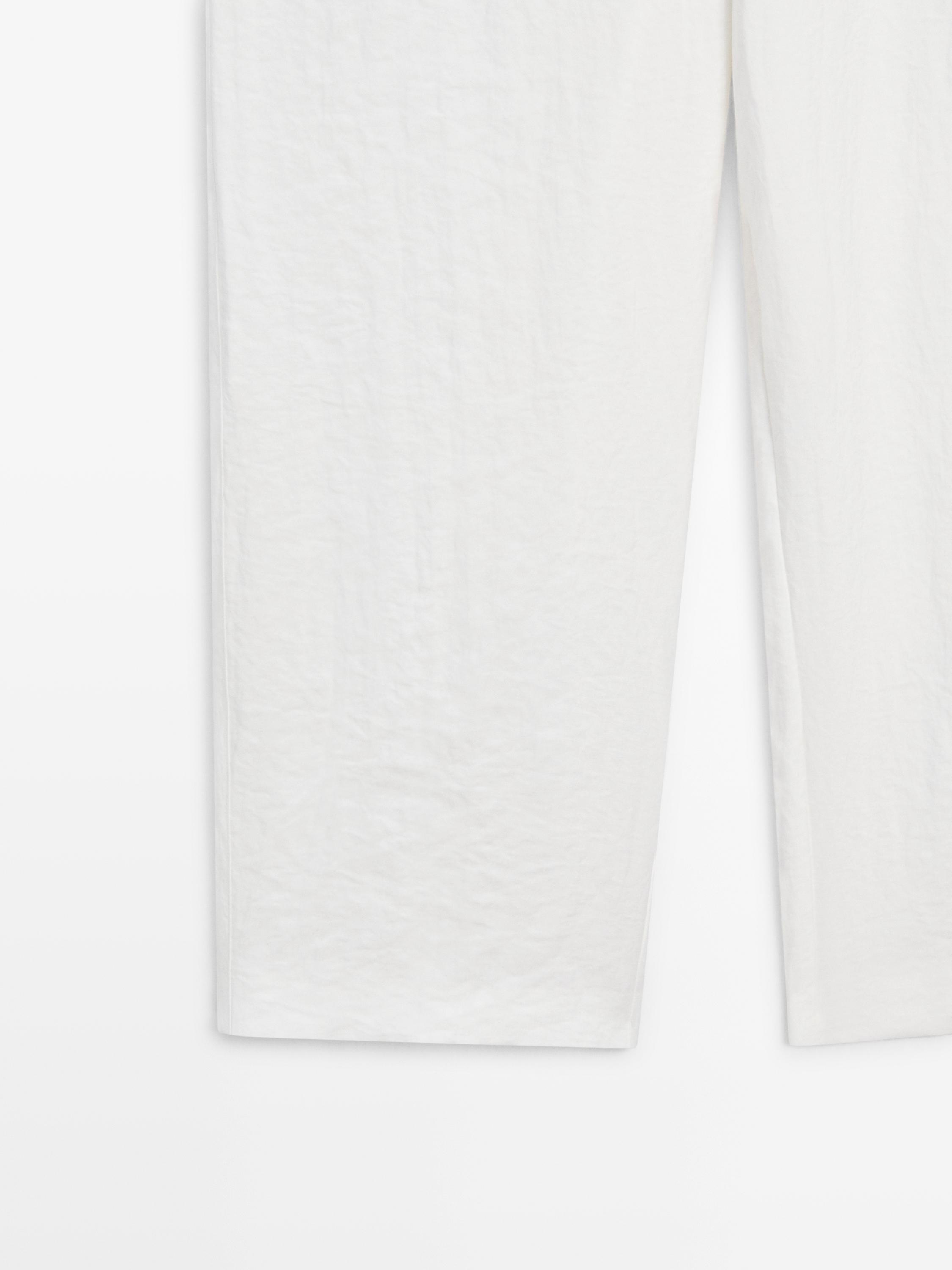 Flowing trousers with buckles — WHITE