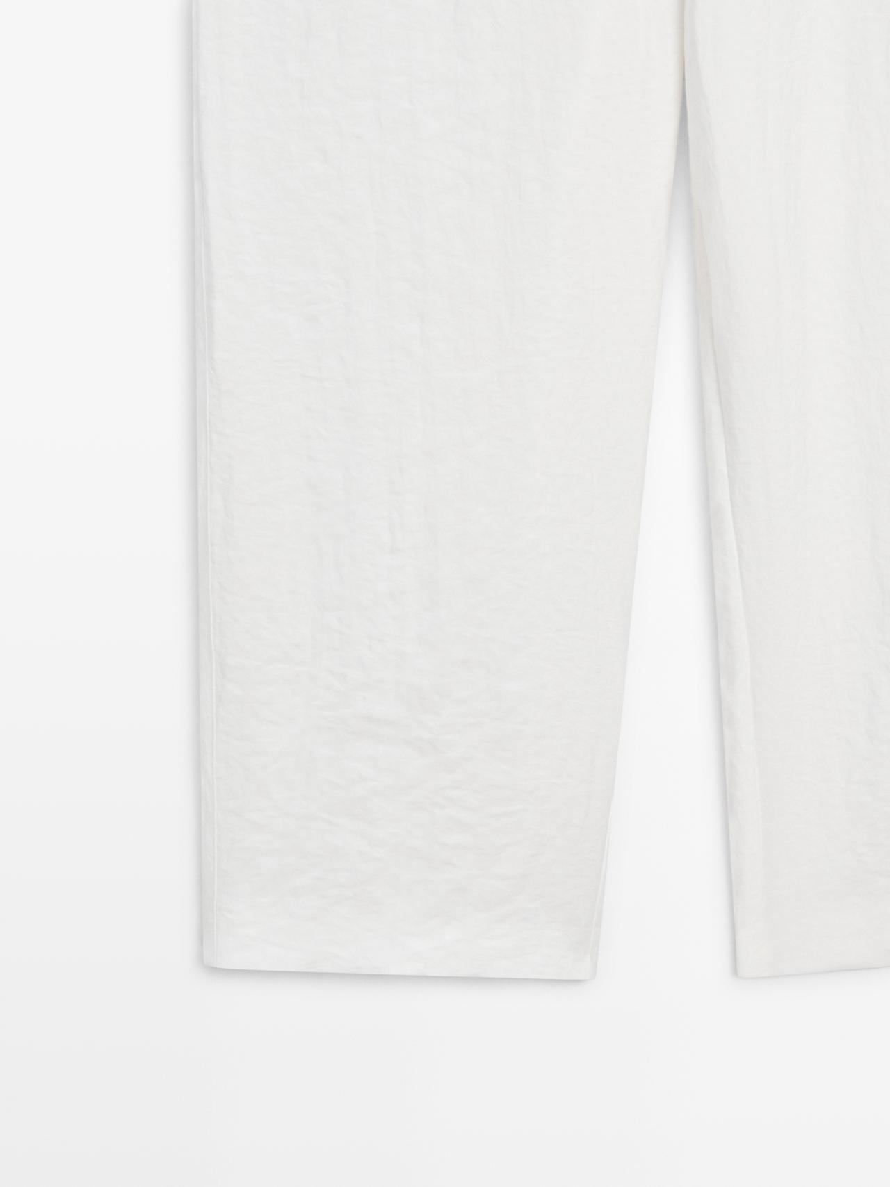 Flowing trousers with buckles — WHITE