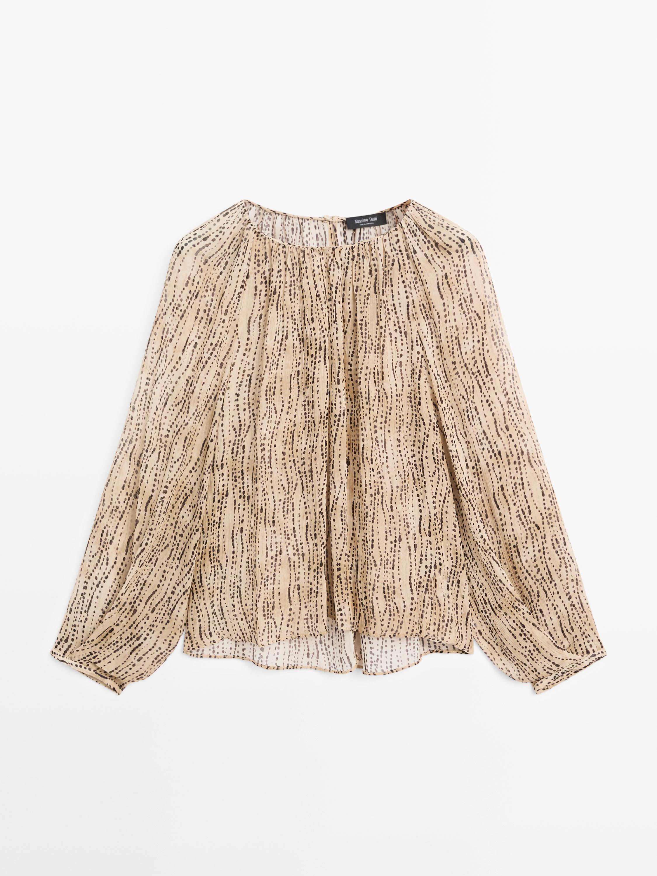 Semi-sheer draped blouse