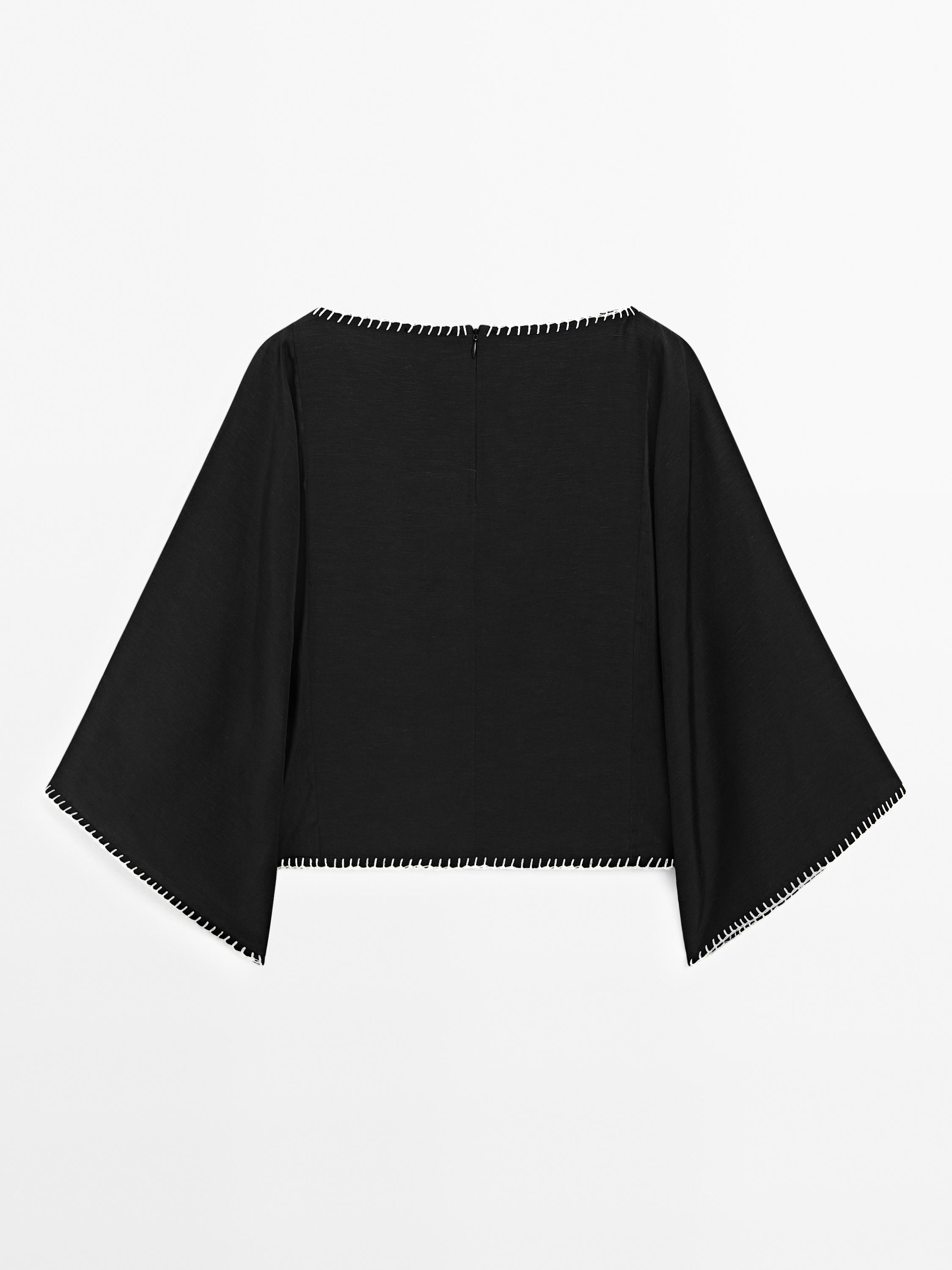 Cape blouse with batwing sleeves