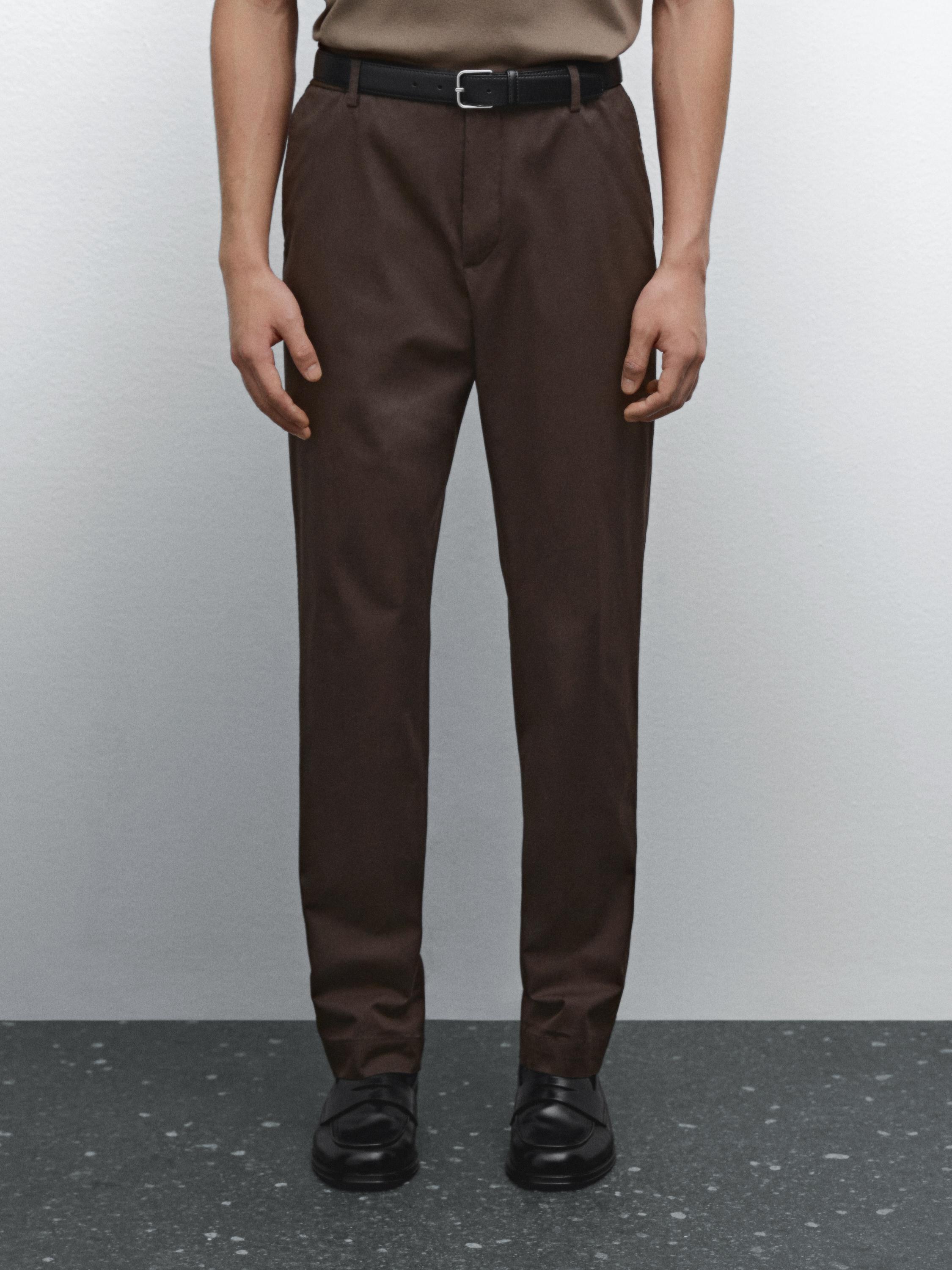 Tapered fit trousers with side elastic detail