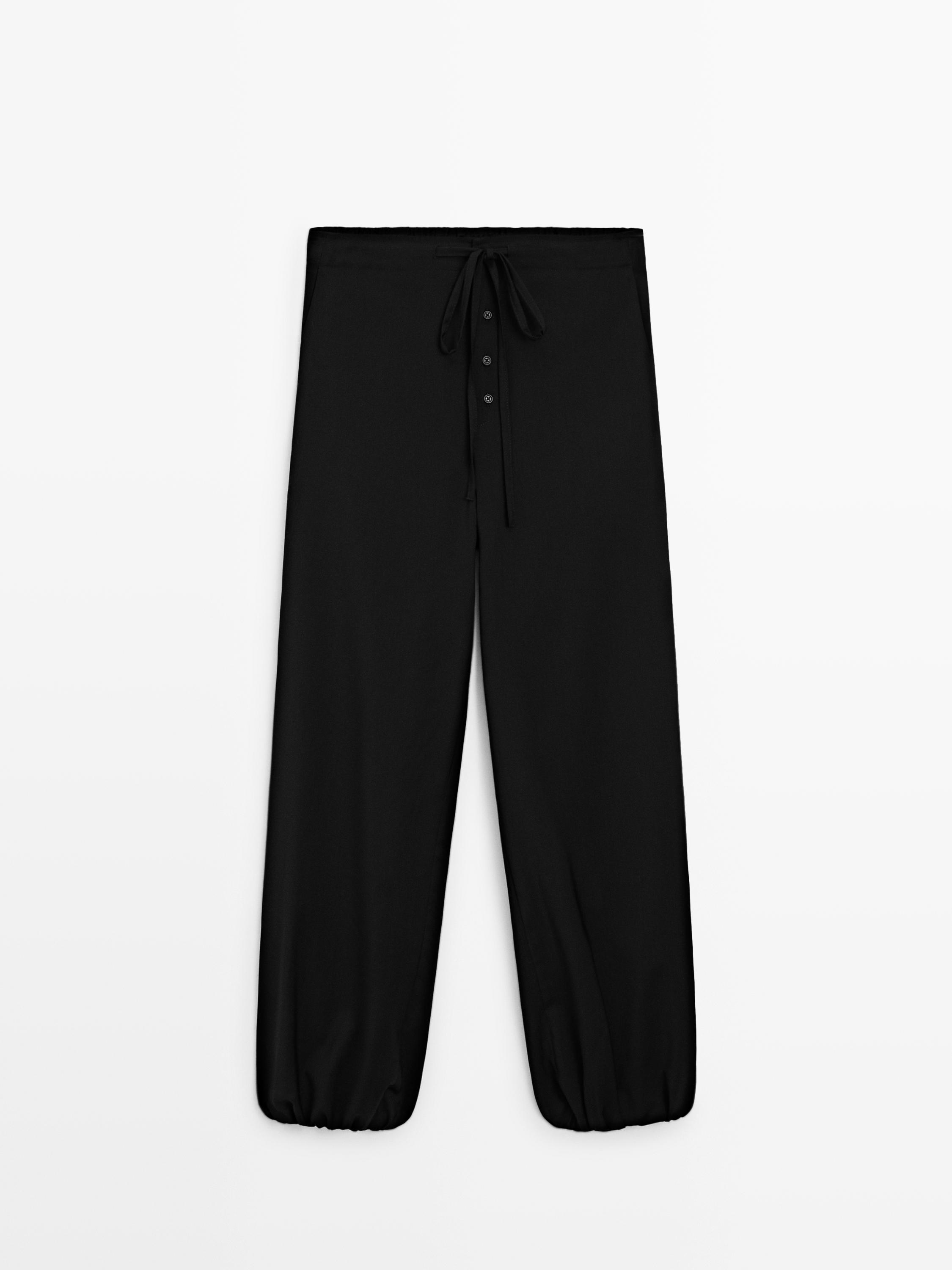 Wool sarouel trousers with tie detail — BLACK