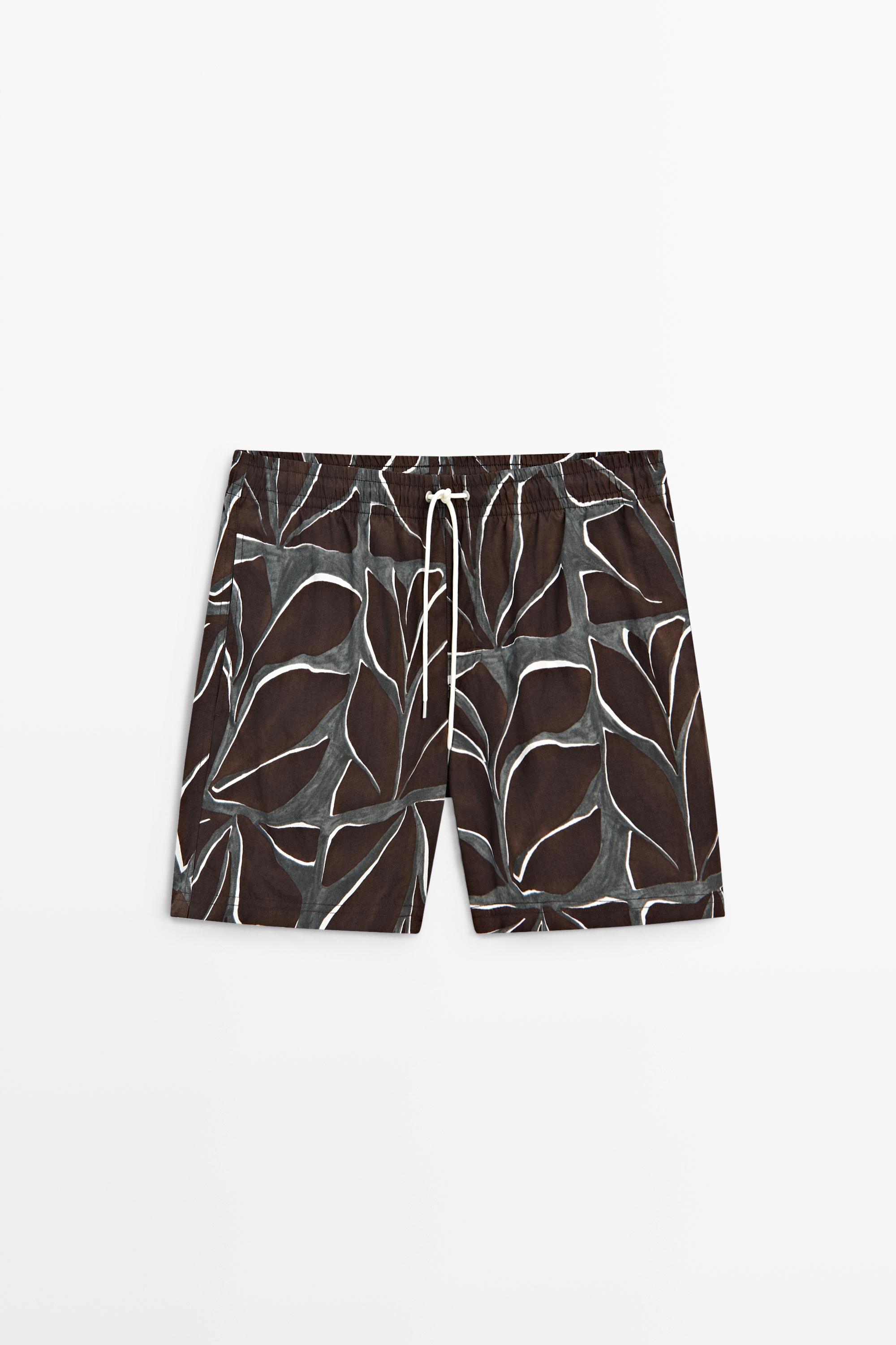 Tropical print swimming trunks
