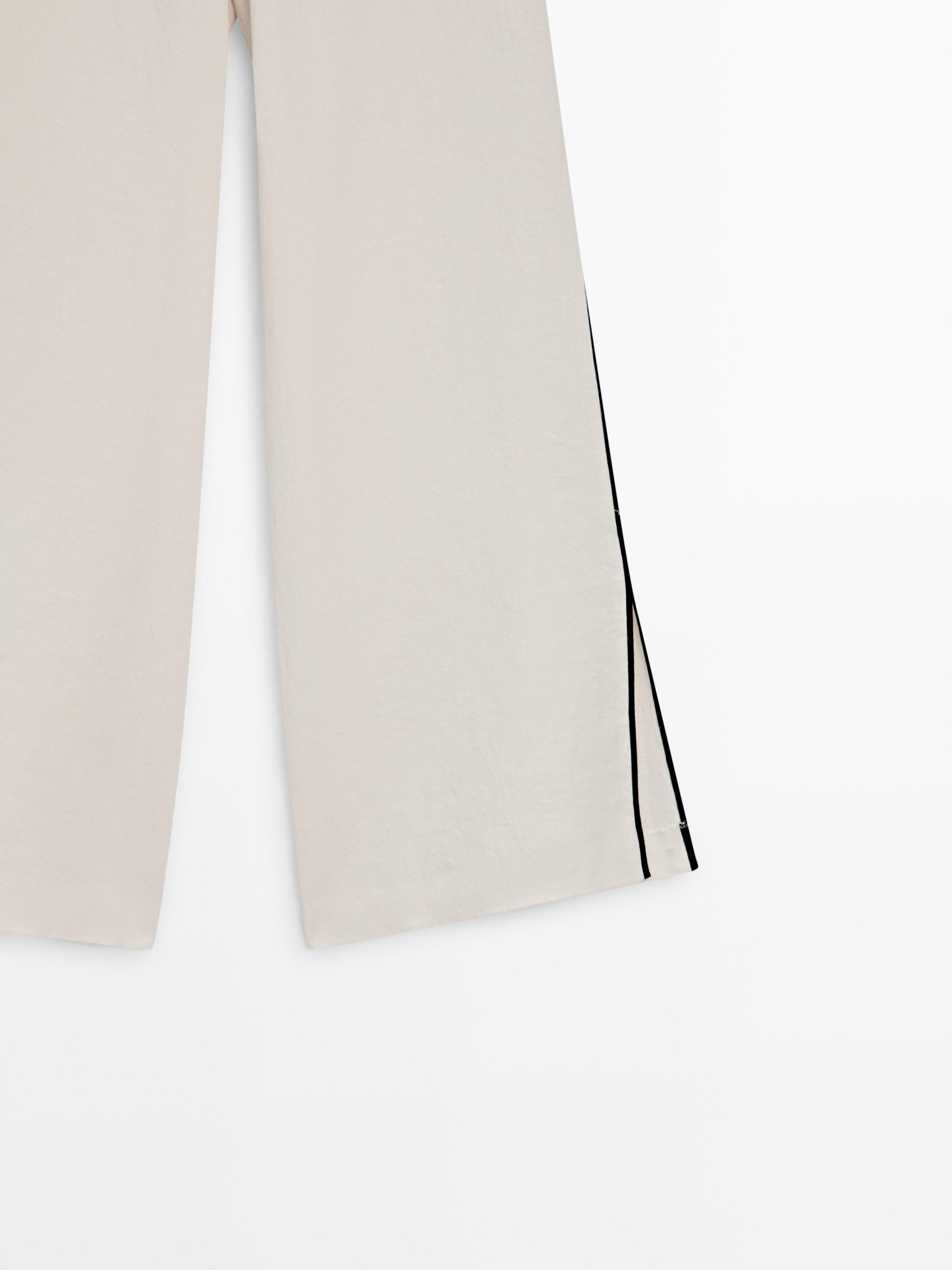 Linen trousers with contrast piping — CREAM