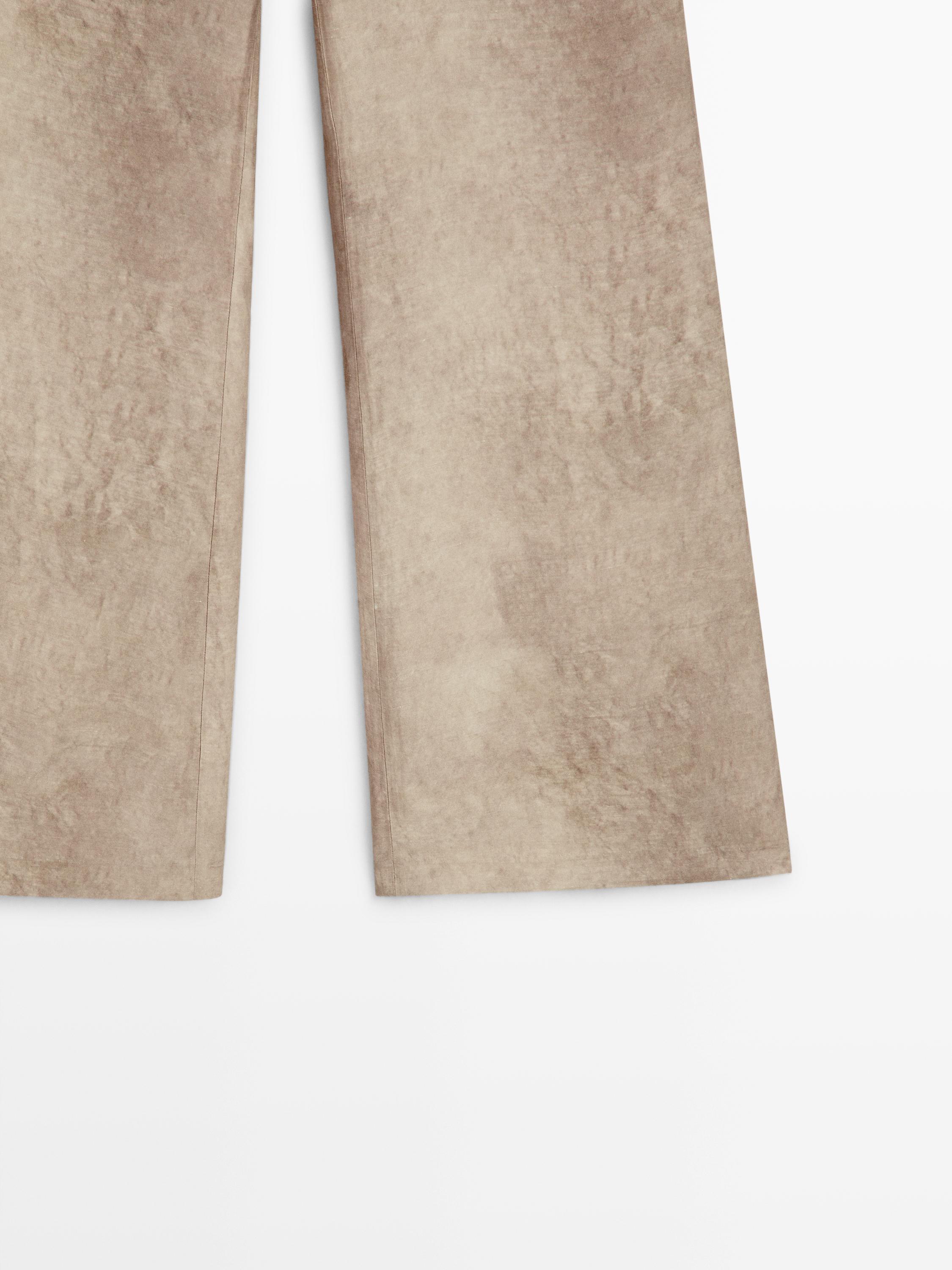 Distressed-effect flowing trousers — STONE
