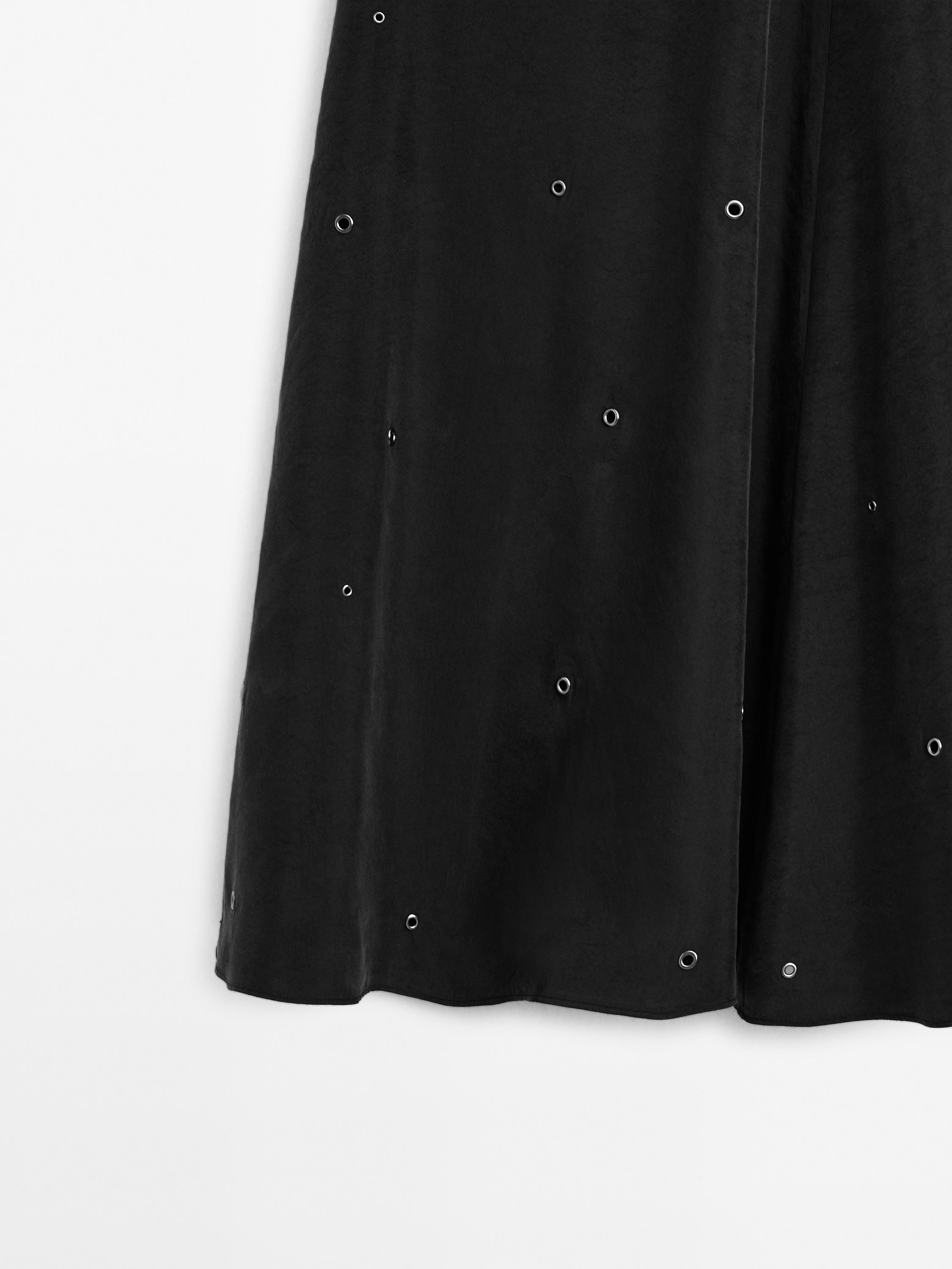 Long skirt with eyelets