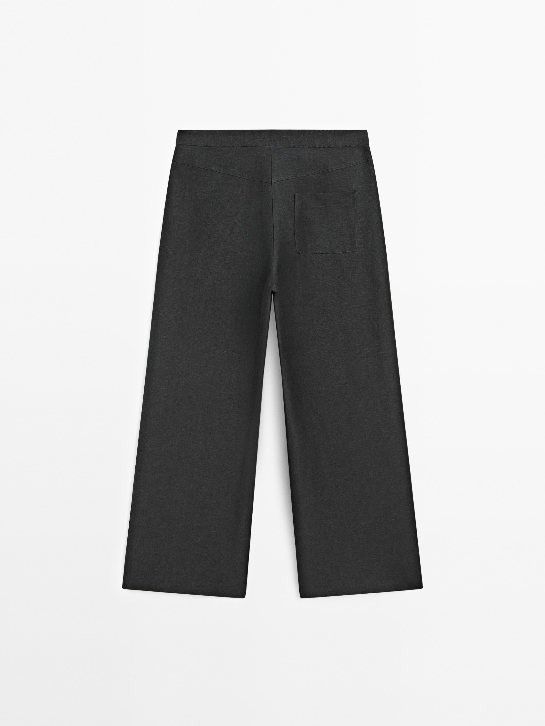Flowing wide-leg trousers with seam details
