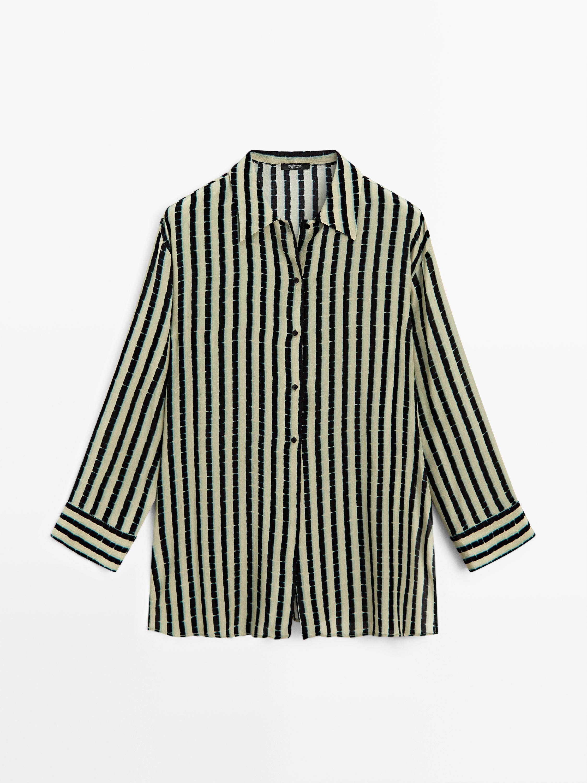 Front view of a fluid aqua green shirt with vertical black stripes, classic collar and central button placket. Long sleeves.