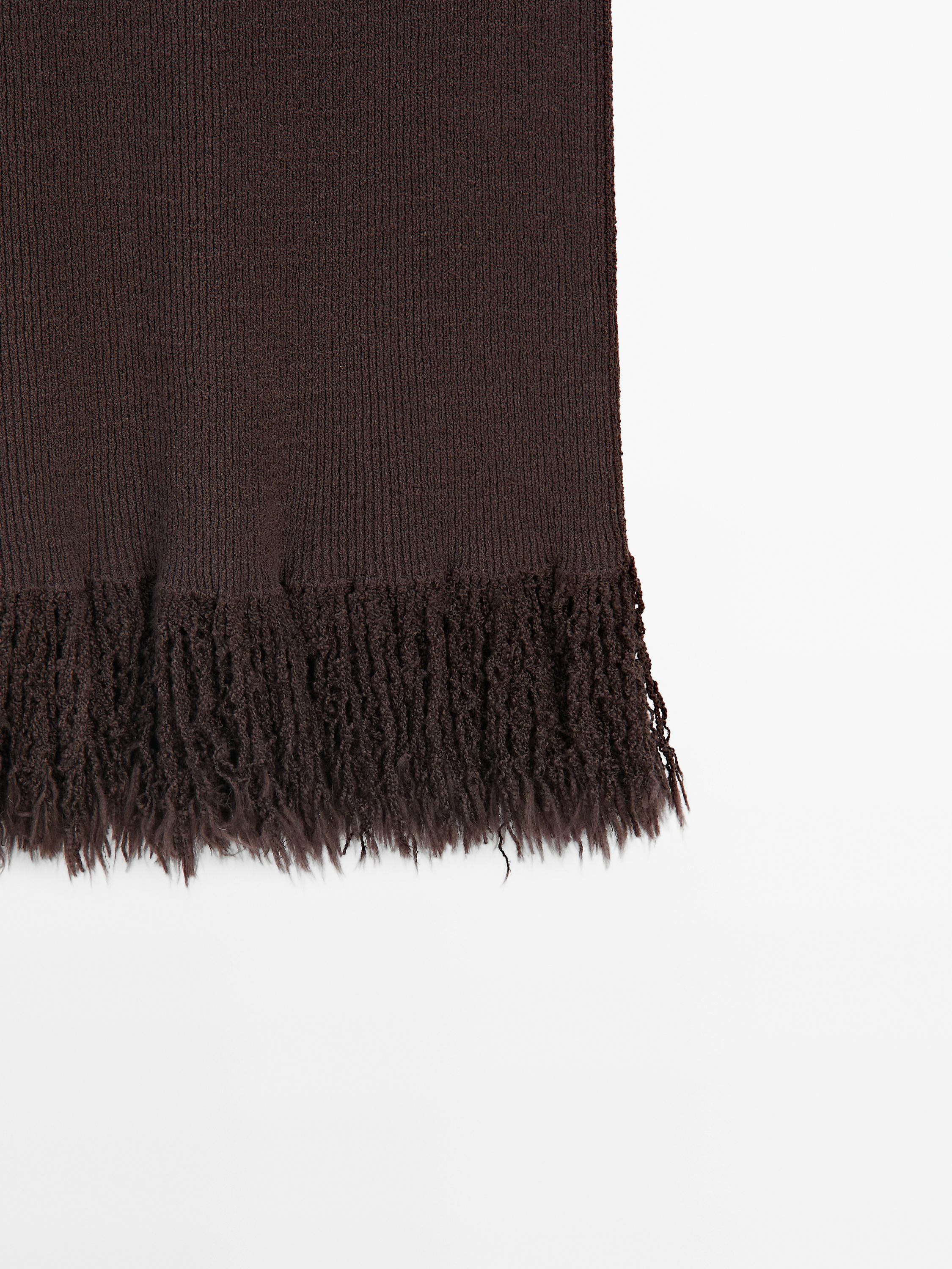 Long knit skirt with fringed hem