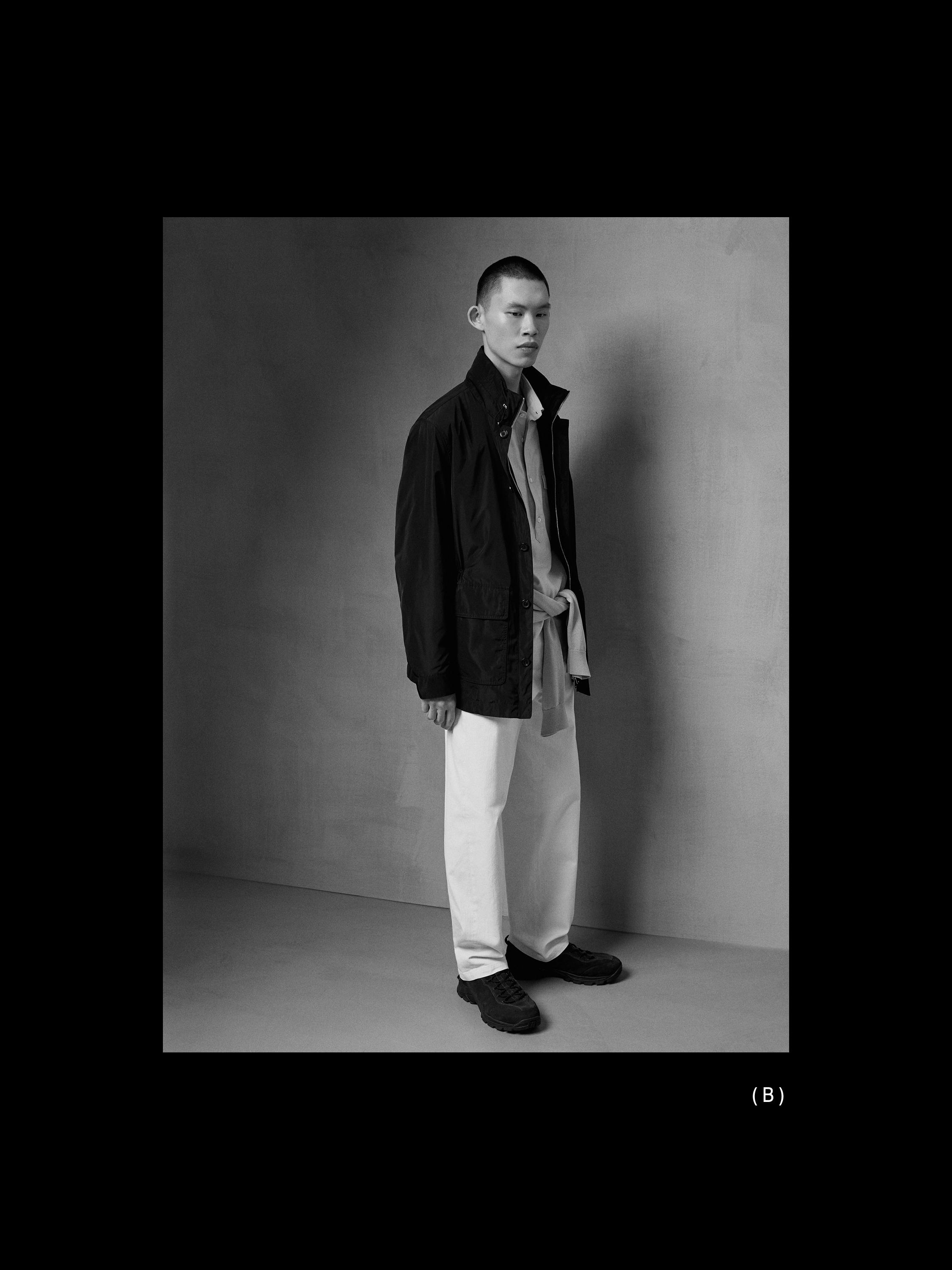 ชุดแจ็คเก็ตสีดำมีกระเป๋า, เสื้อเชิ้ตสีอ่อน, กางเกงสีขาว และรองเท้าสีเข้ม