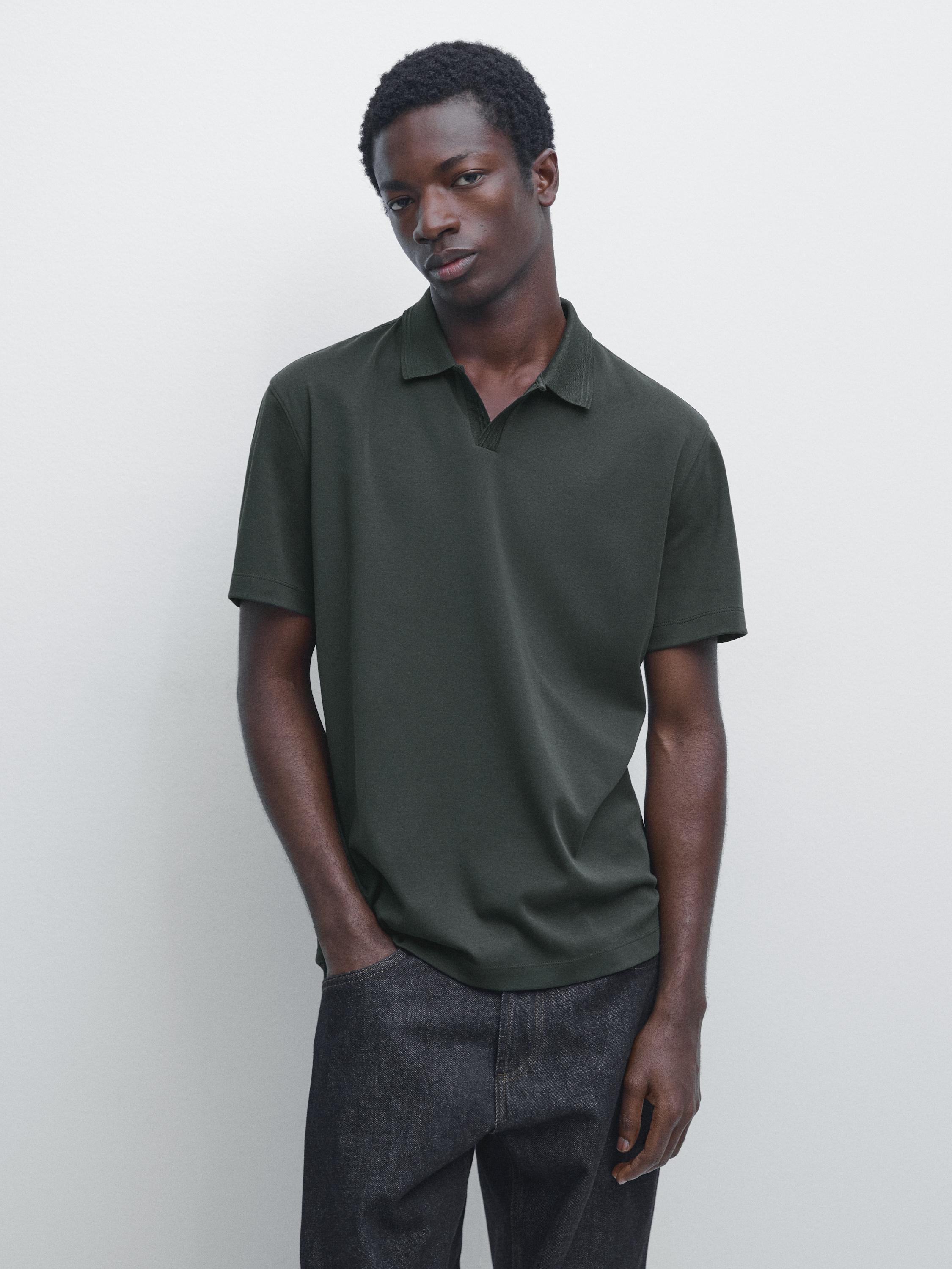 Bottle green short-sleeve polo shirt and dark pants set.