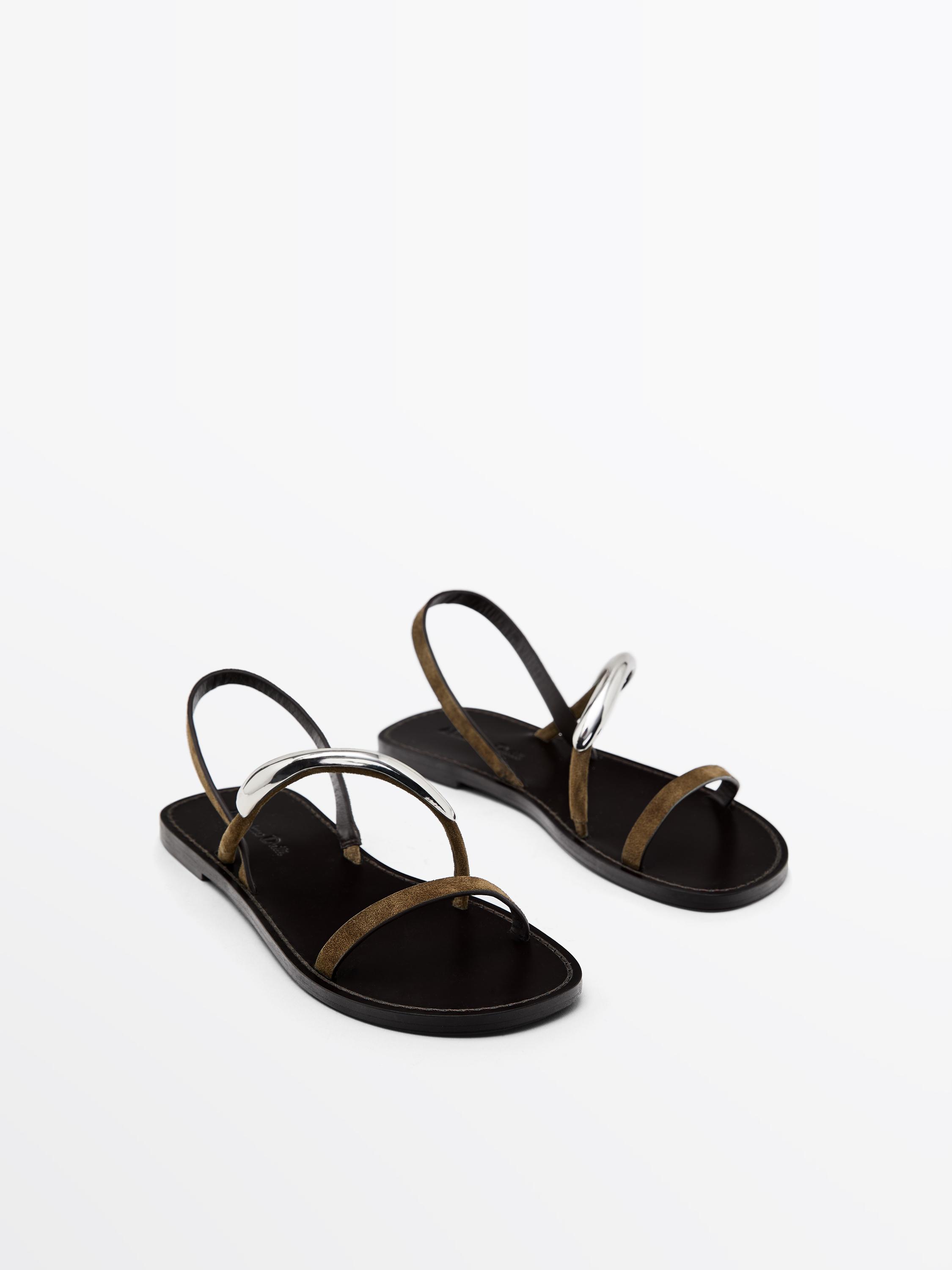 Flat sandals with metallic embellishment