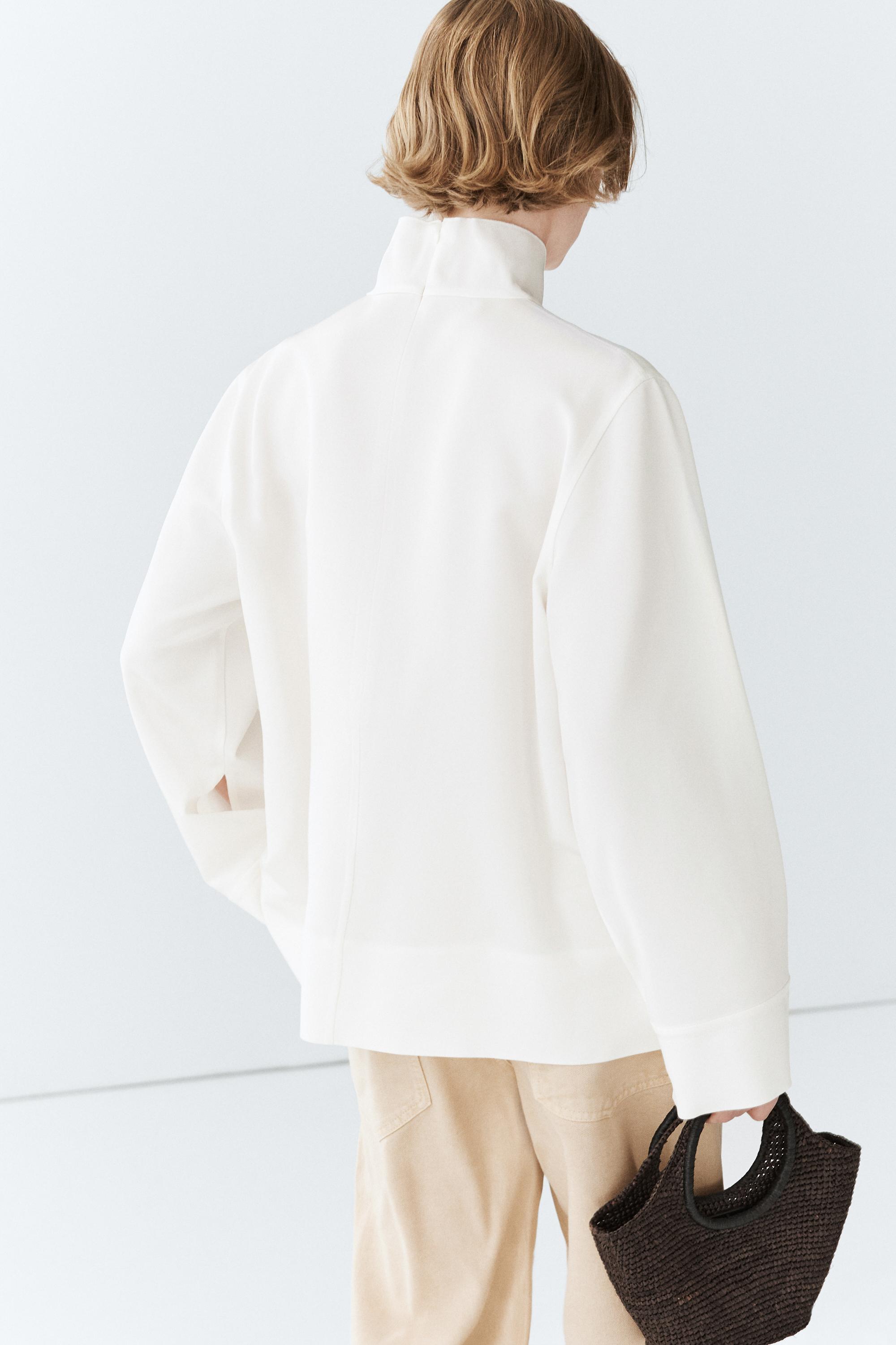 High neck blouse with hem detail — WHITE