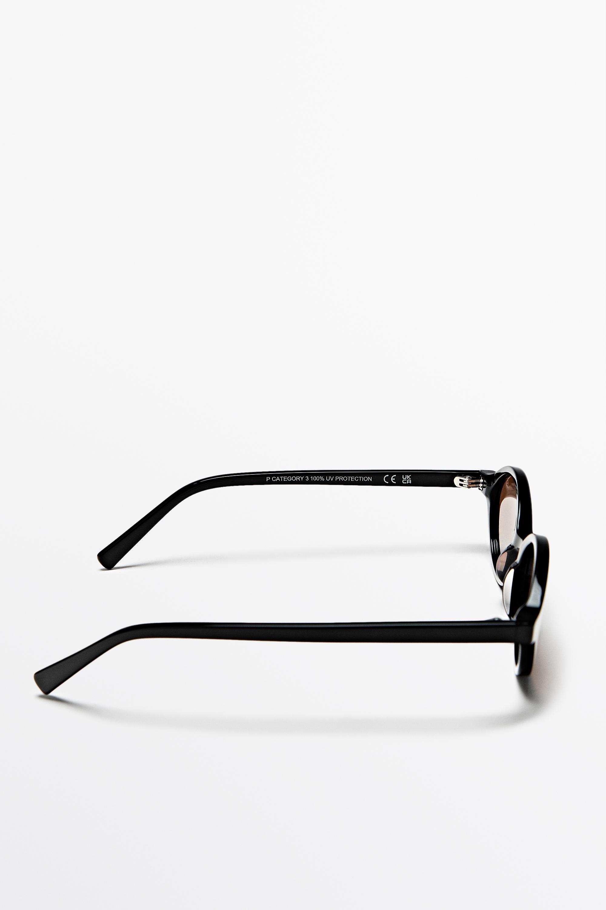 Oval sunglasses — BLACK