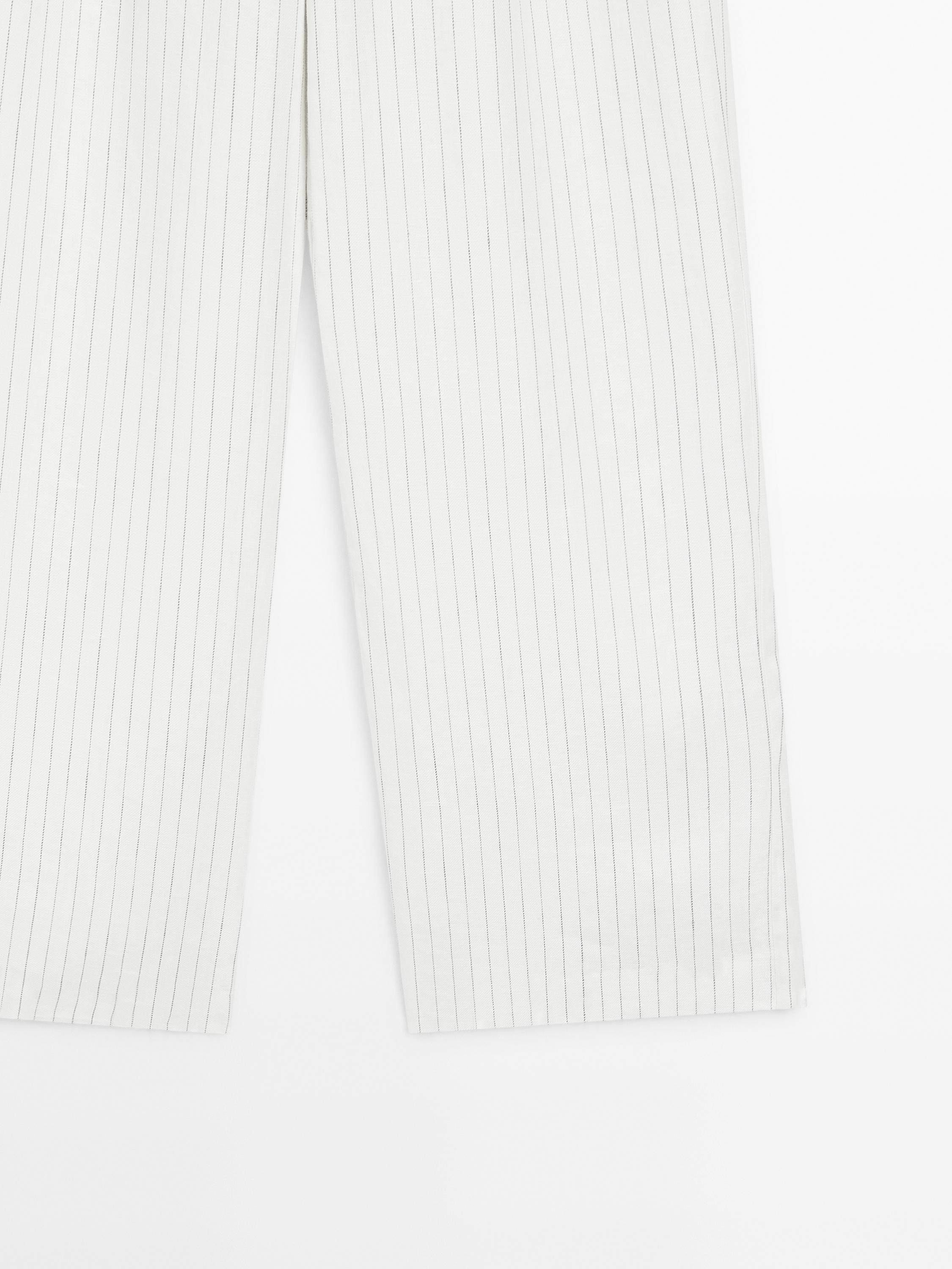 100% linen striped trousers with buckle detail