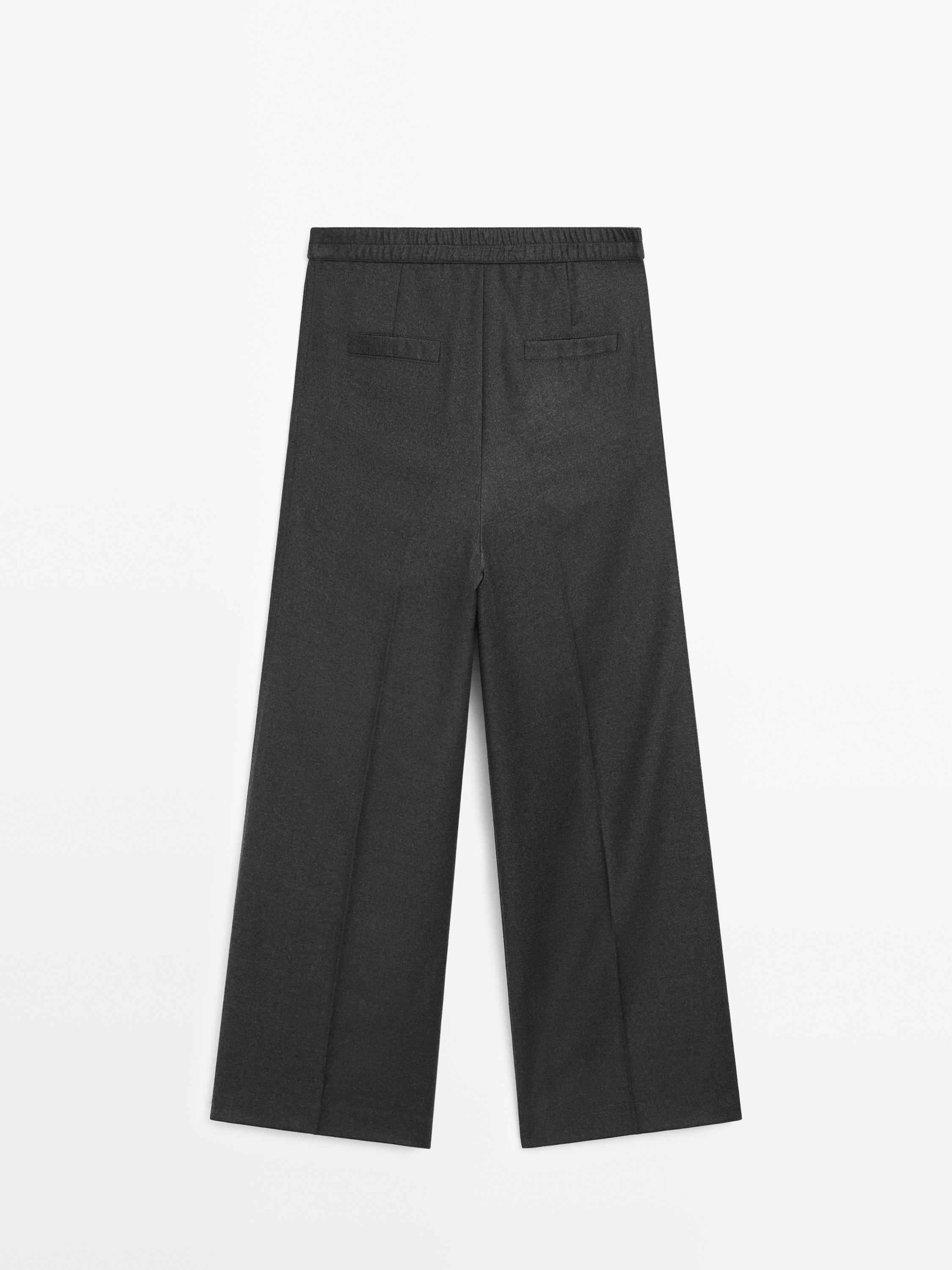 Flannel trousers with elastic detail