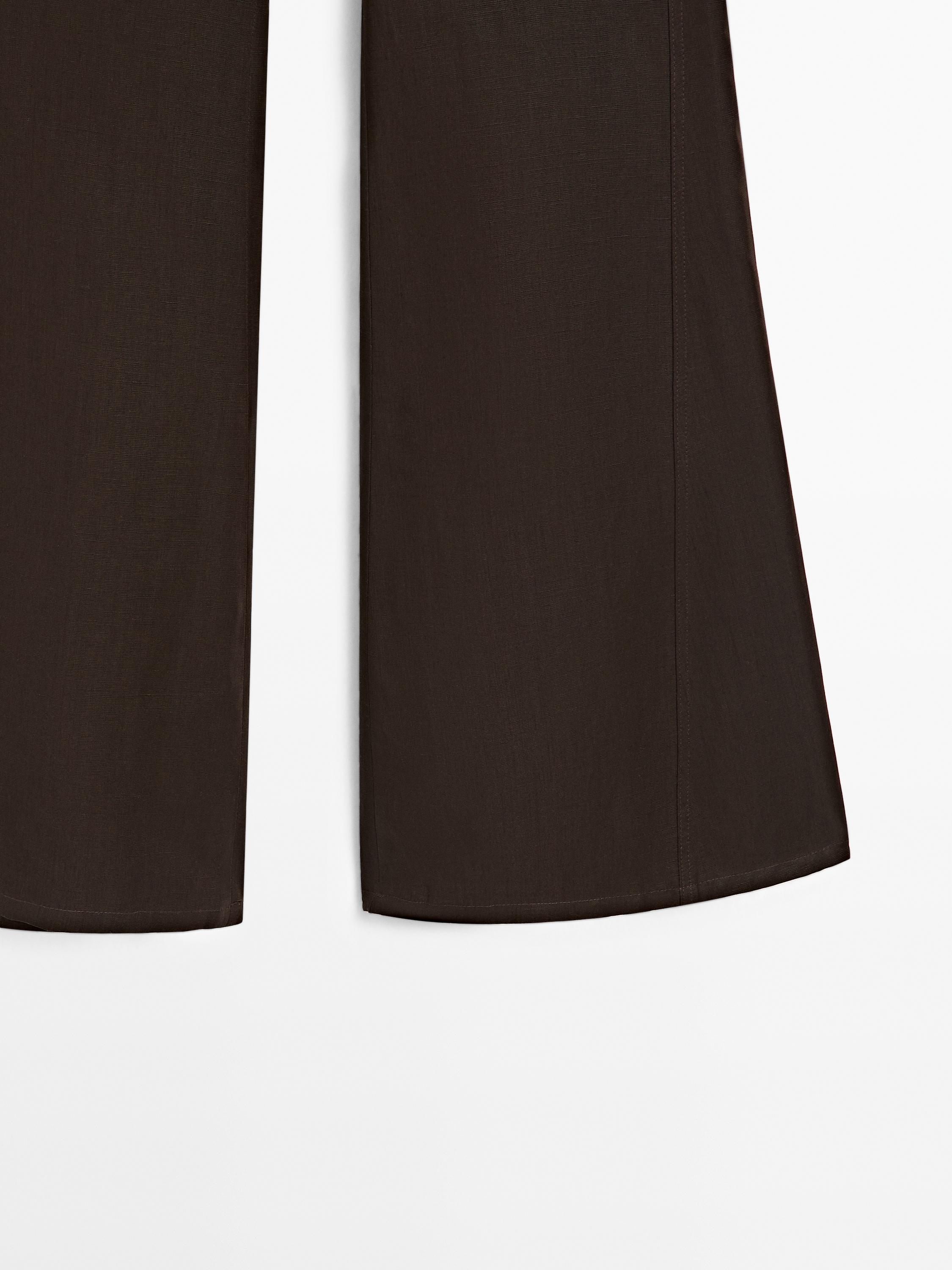 Flared trousers with seams