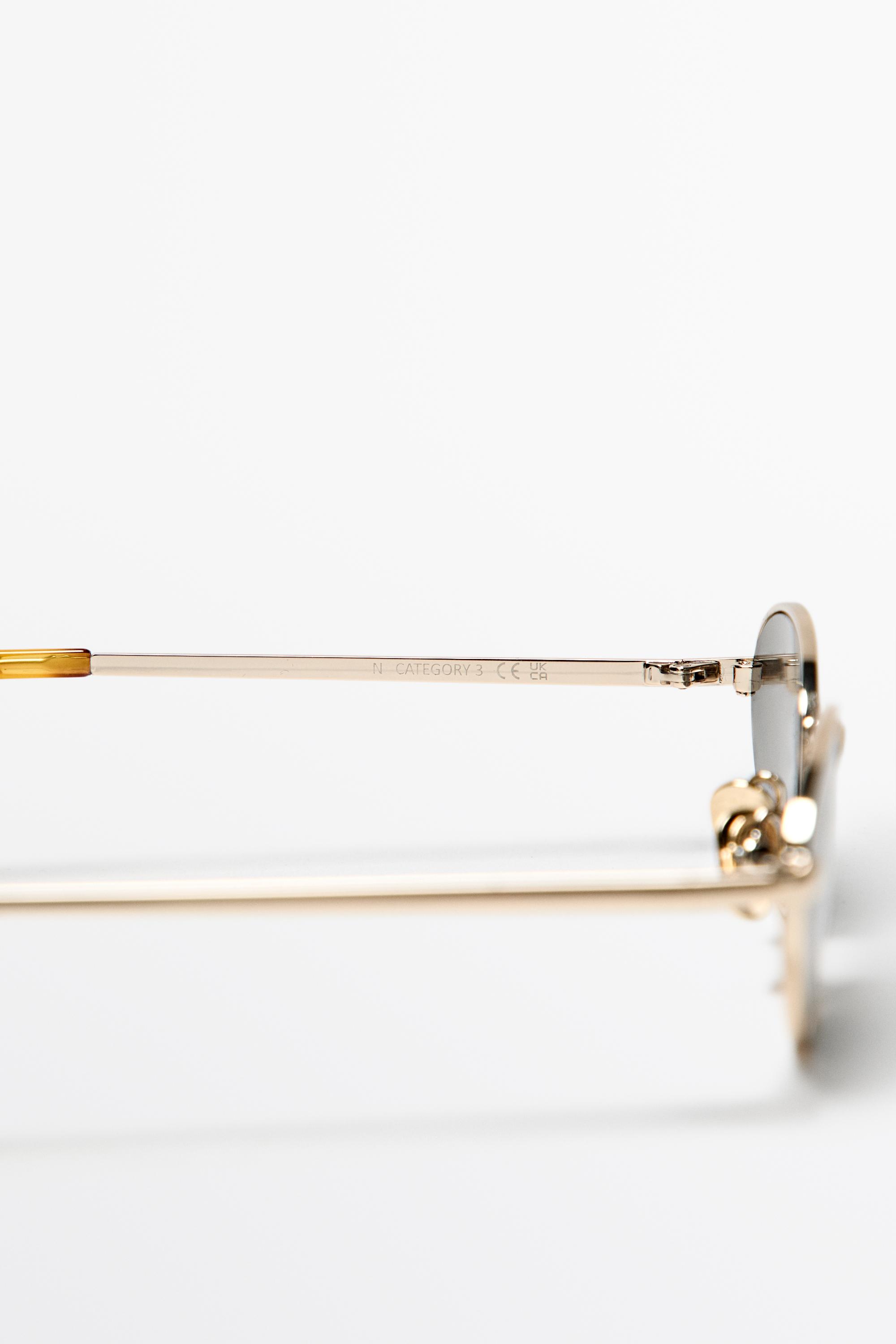 Oval metal sunglasses — GOLDEN