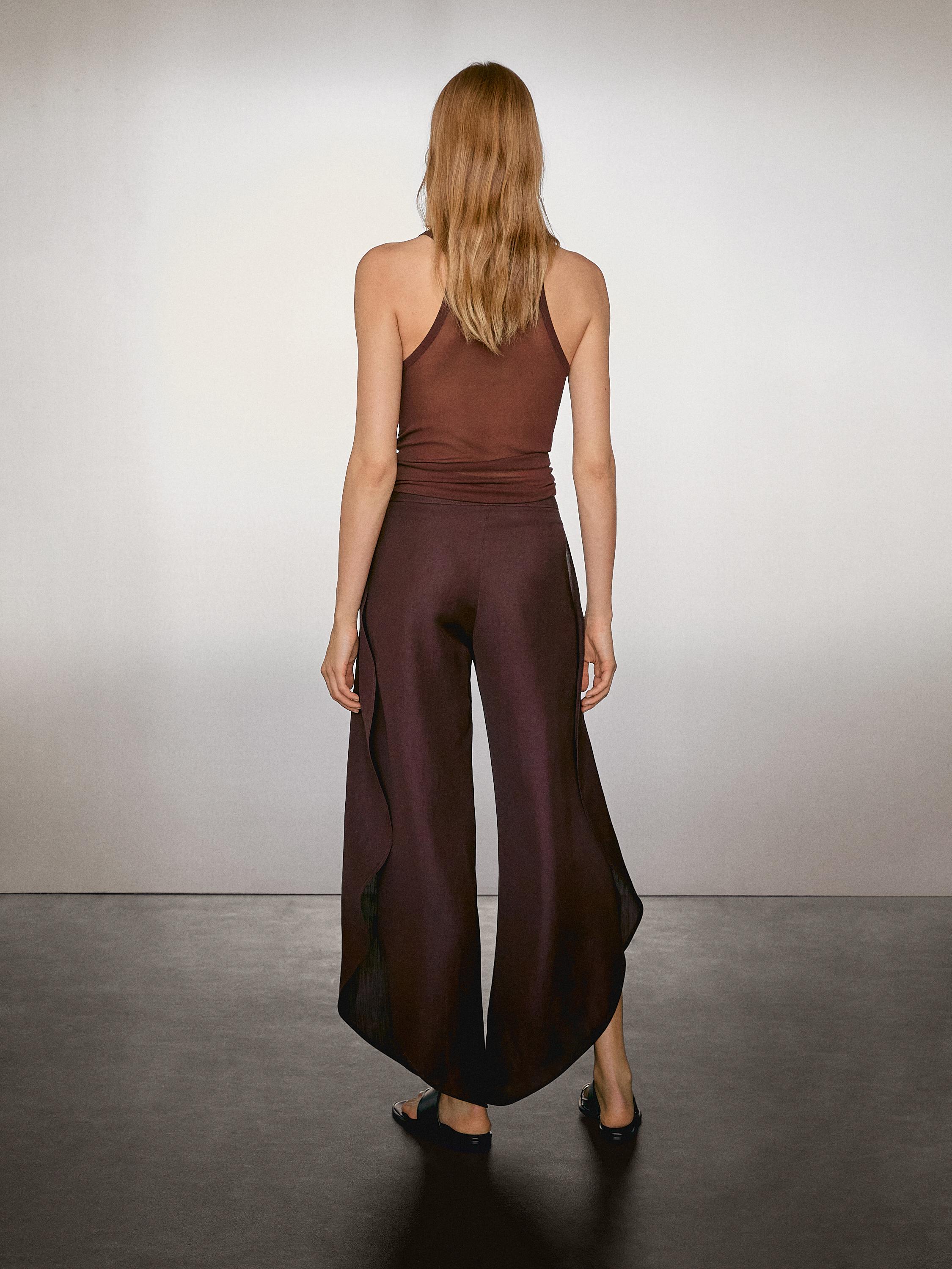 Flowing trousers with side vents
