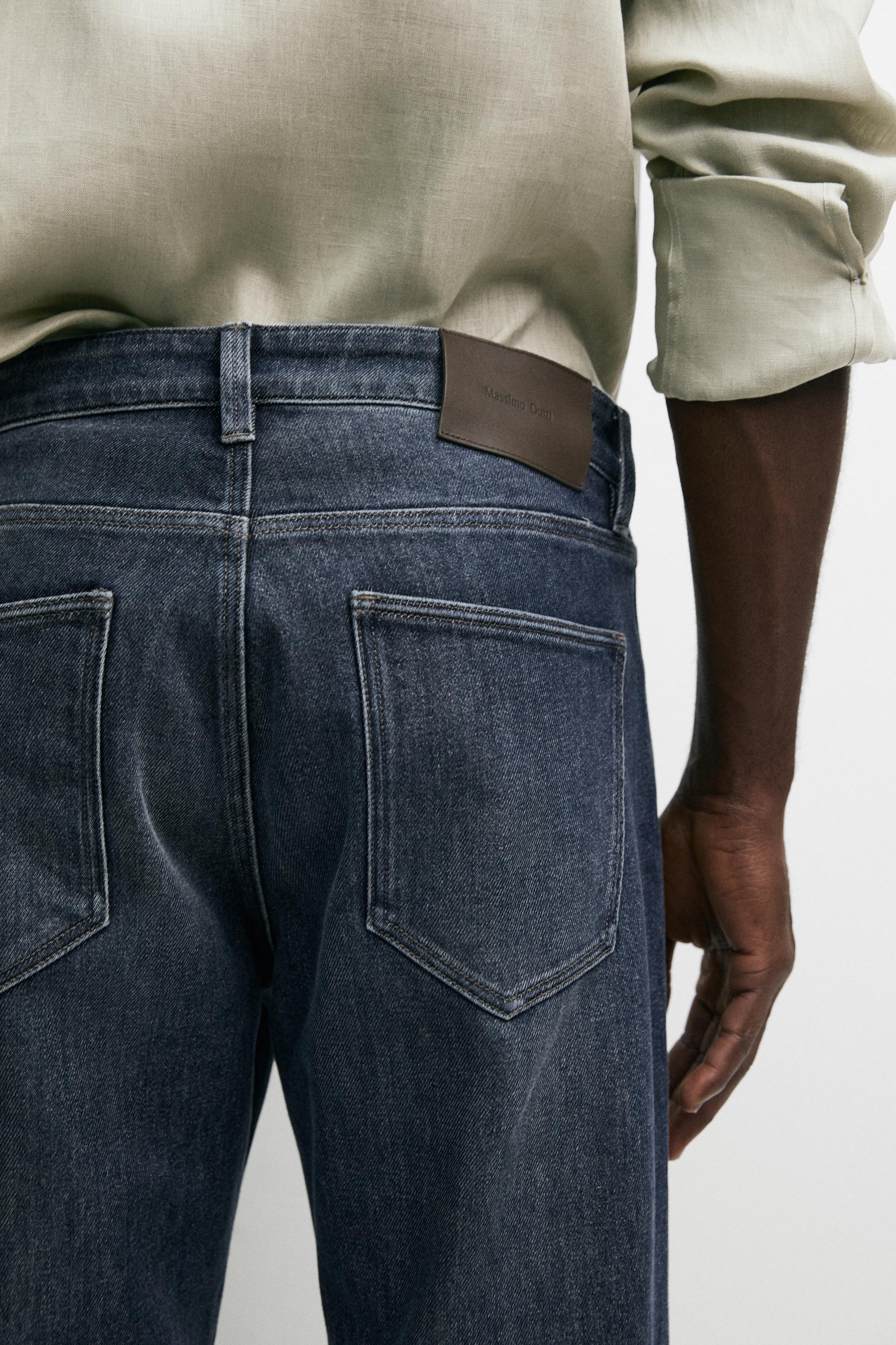 Enzymatic tapered fit jeans — DEEP BLUE