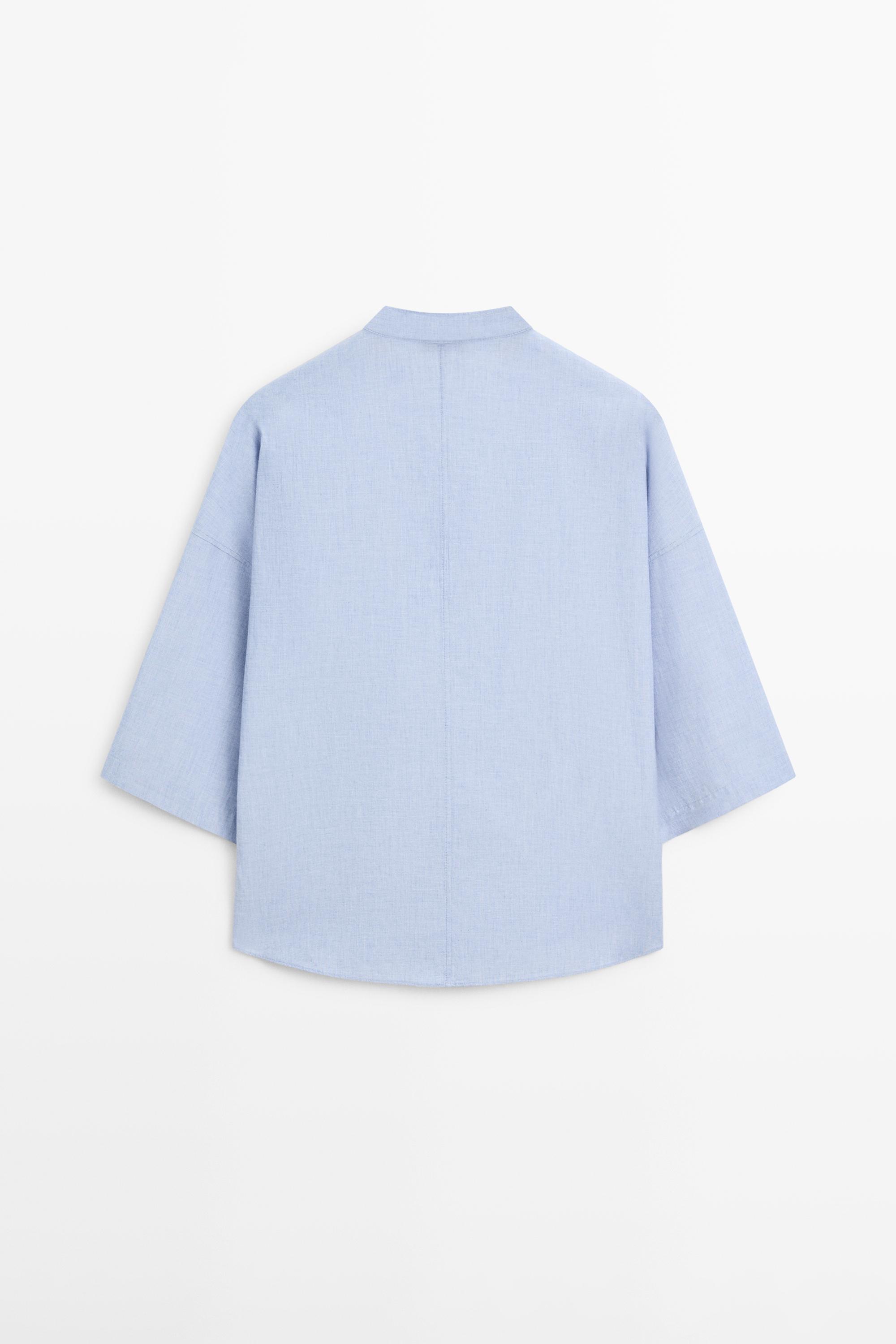 Flowing blouse with buttoned collar detail — Denim blue