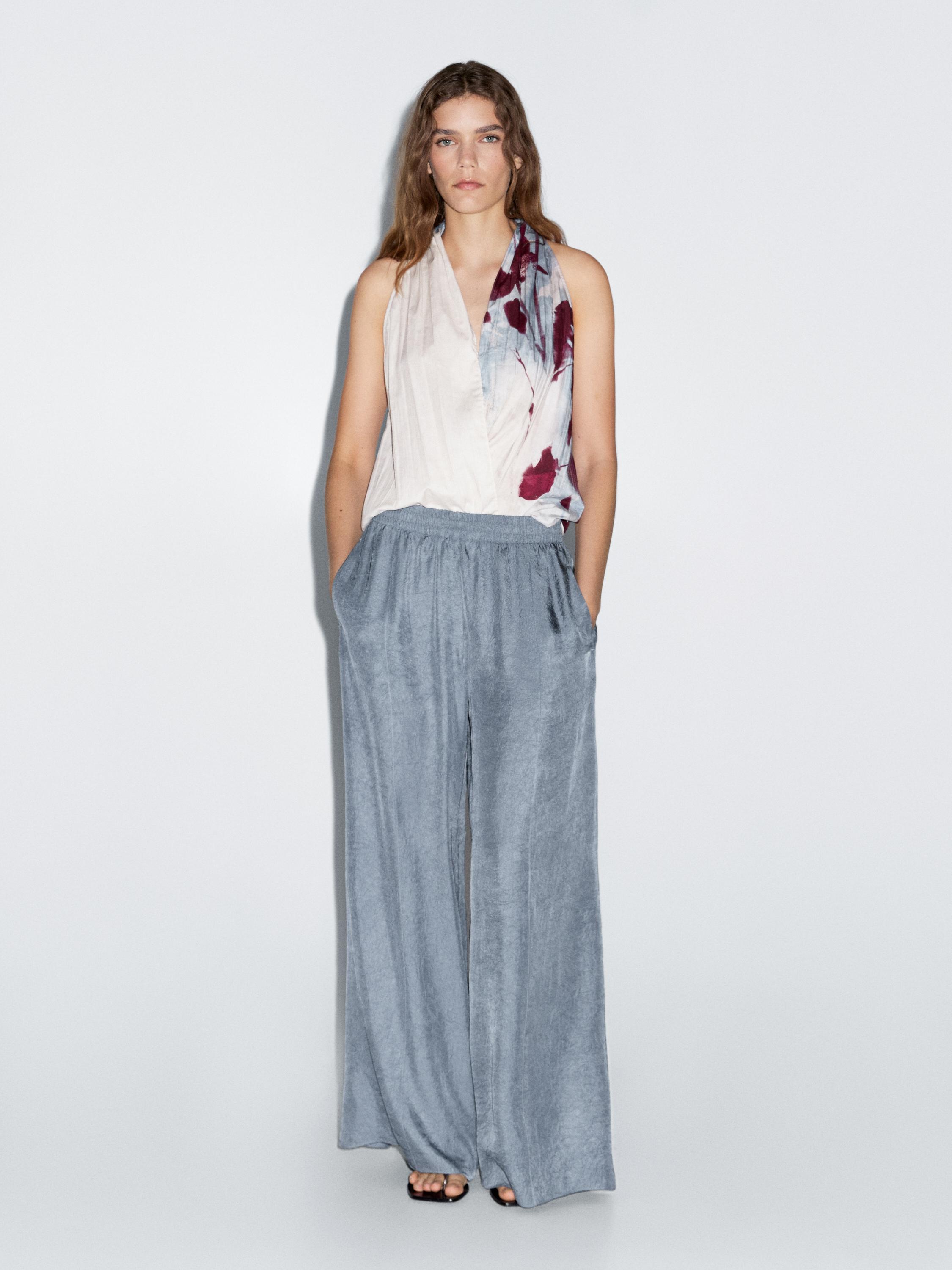 Creased-effect loose-fitting trousers