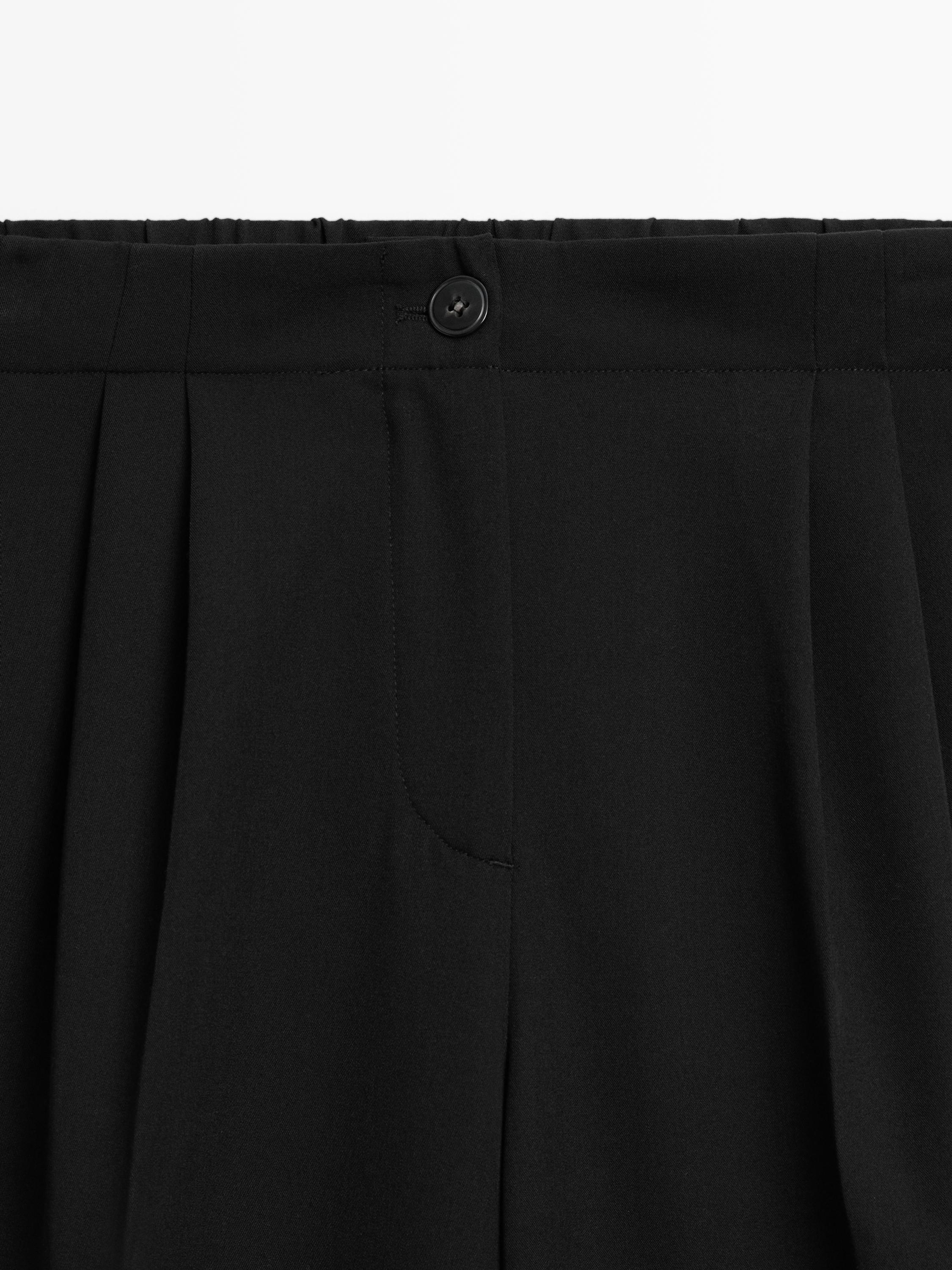 Wide-leg flowing trousers with darts