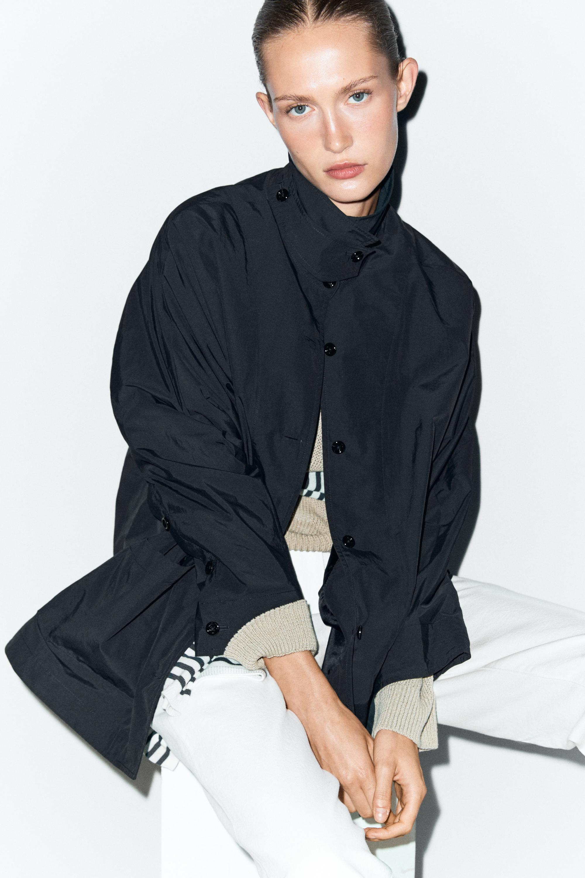 Jacket with buttoned collar strap
