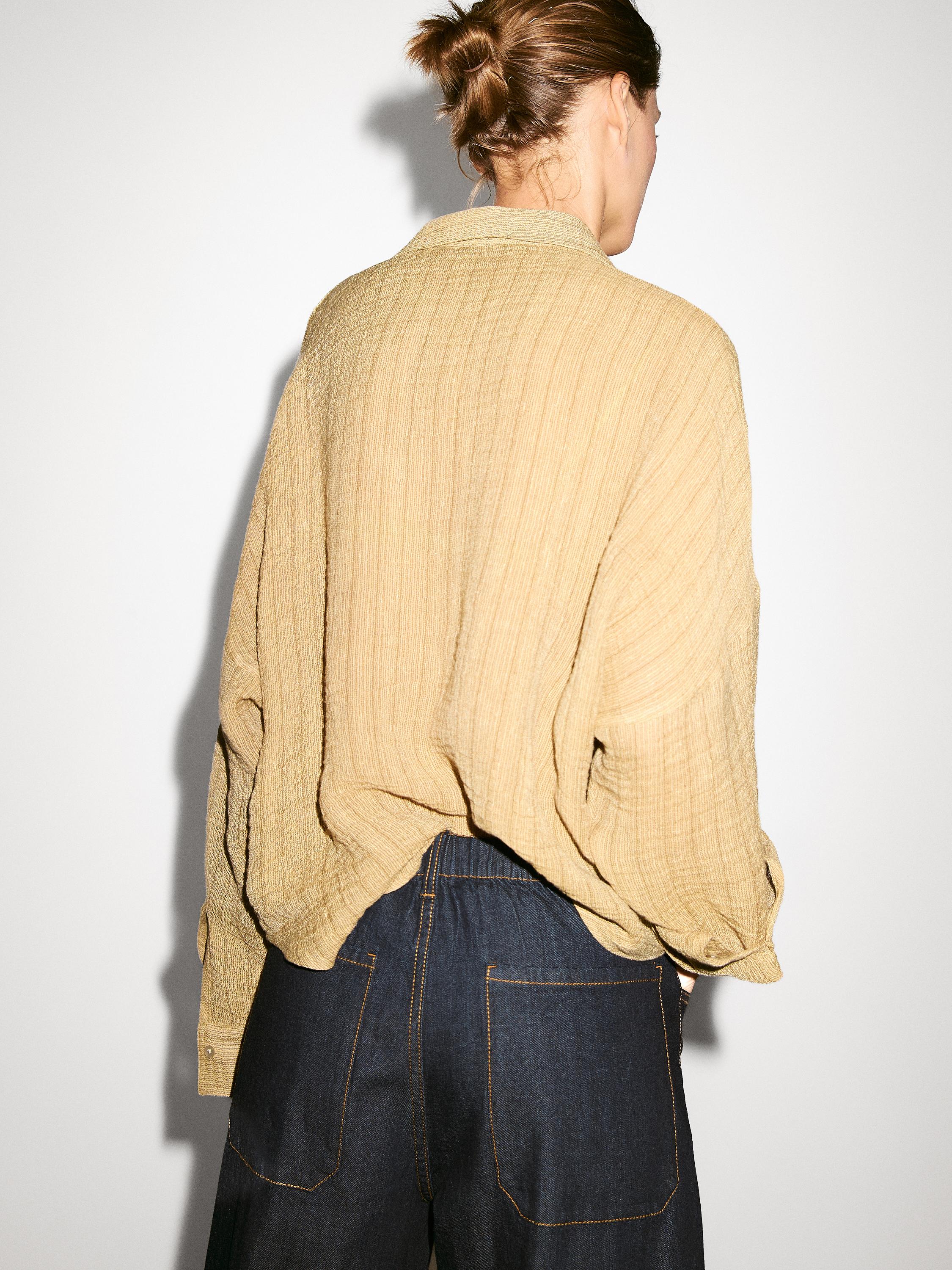 Blusa cuello polo abierto mezcla lino