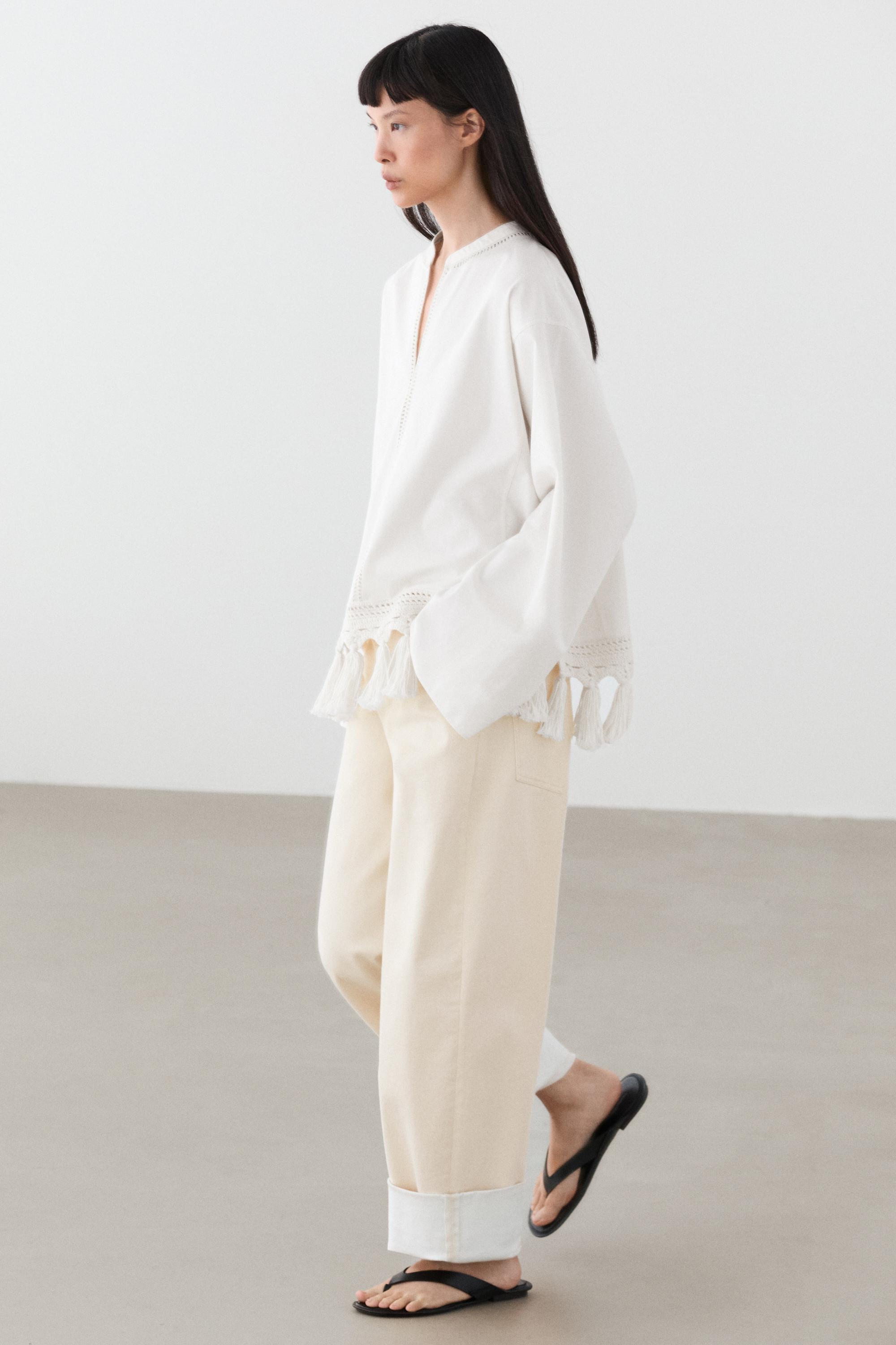 Embroidered blouse with fringed hem — WHITE