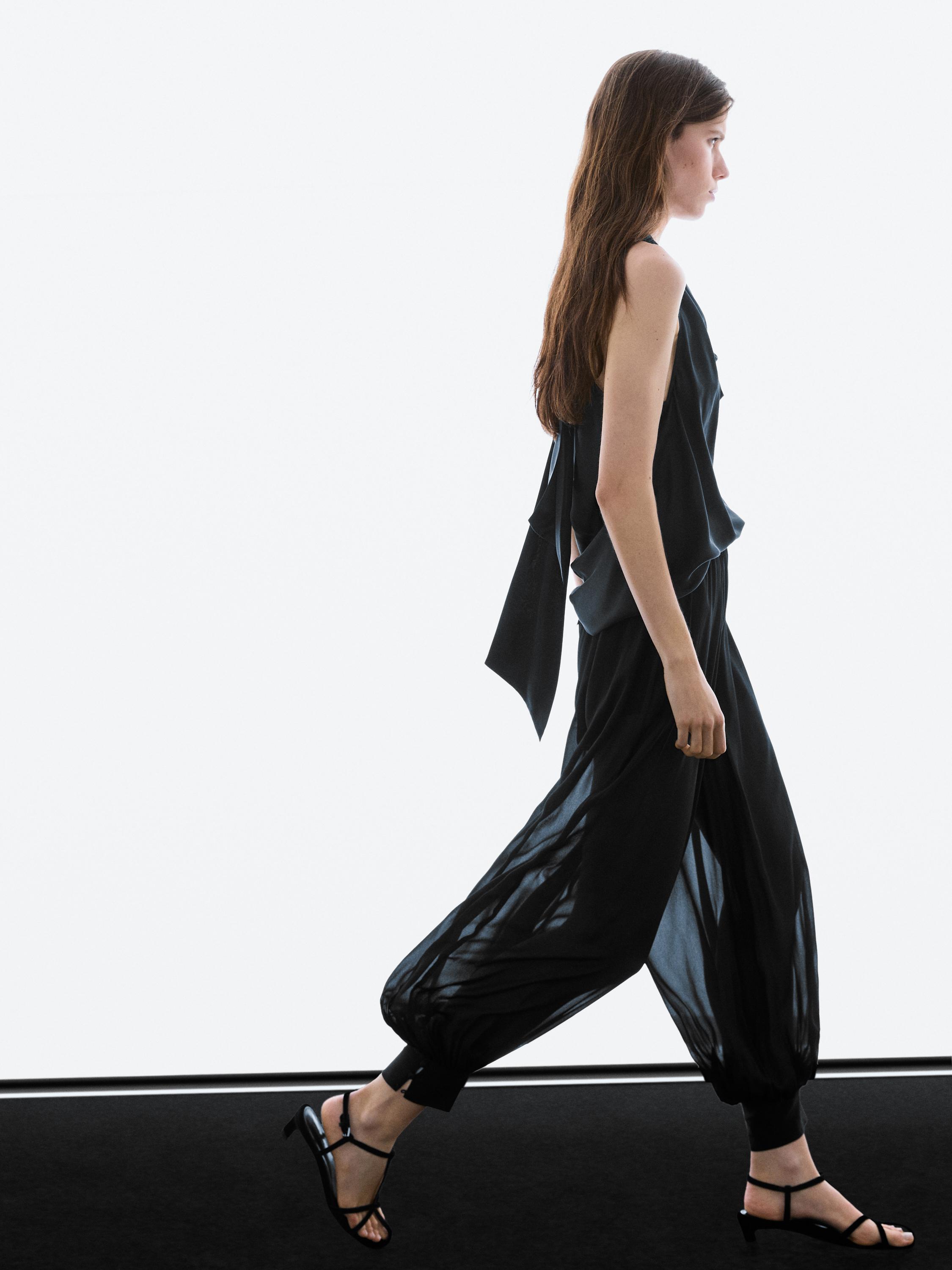 Semi-sheer sarouel trousers with button details — BLACK