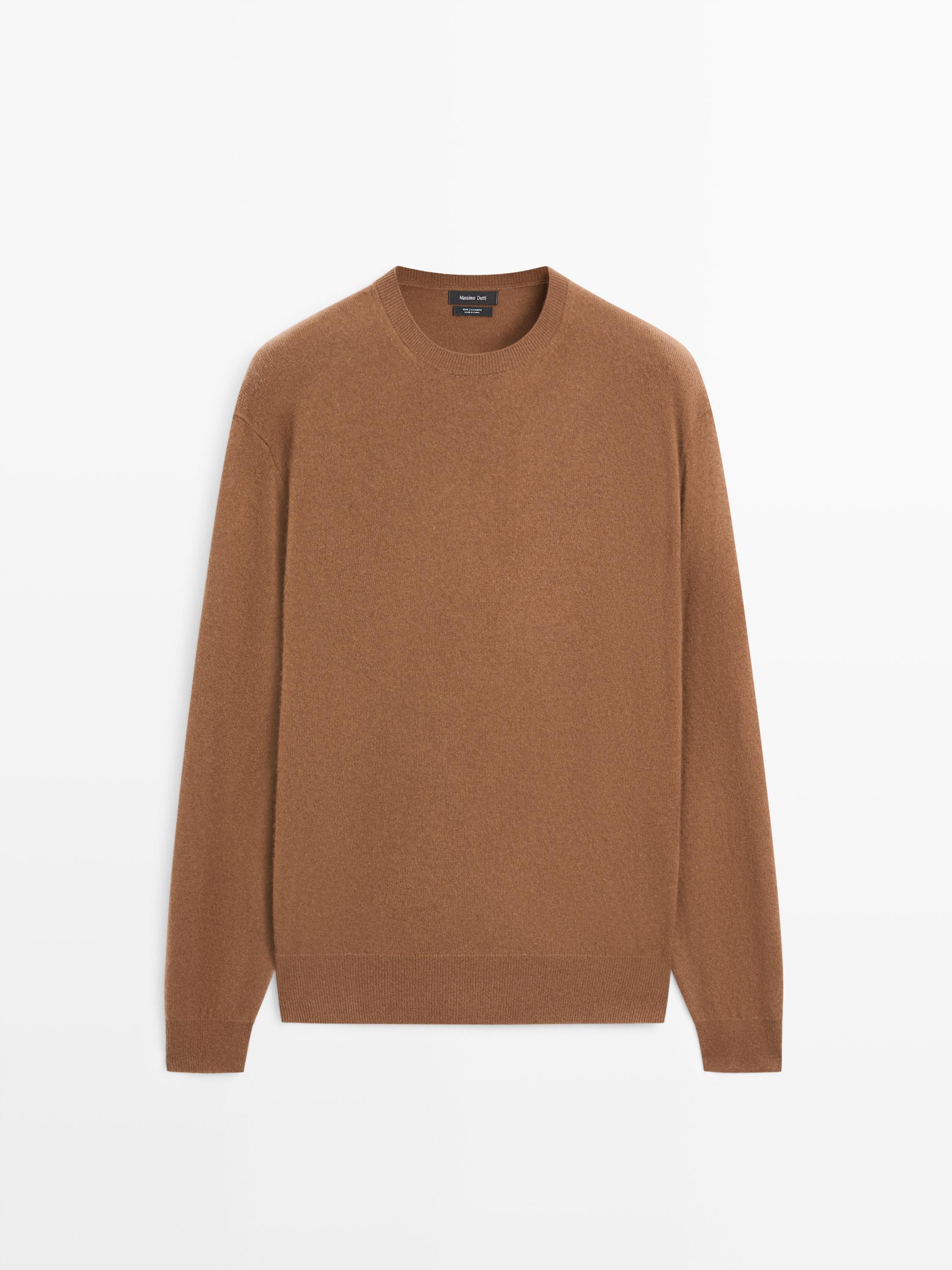 Front view of a tobacco knitted sweater with a round neck and long sleeves.