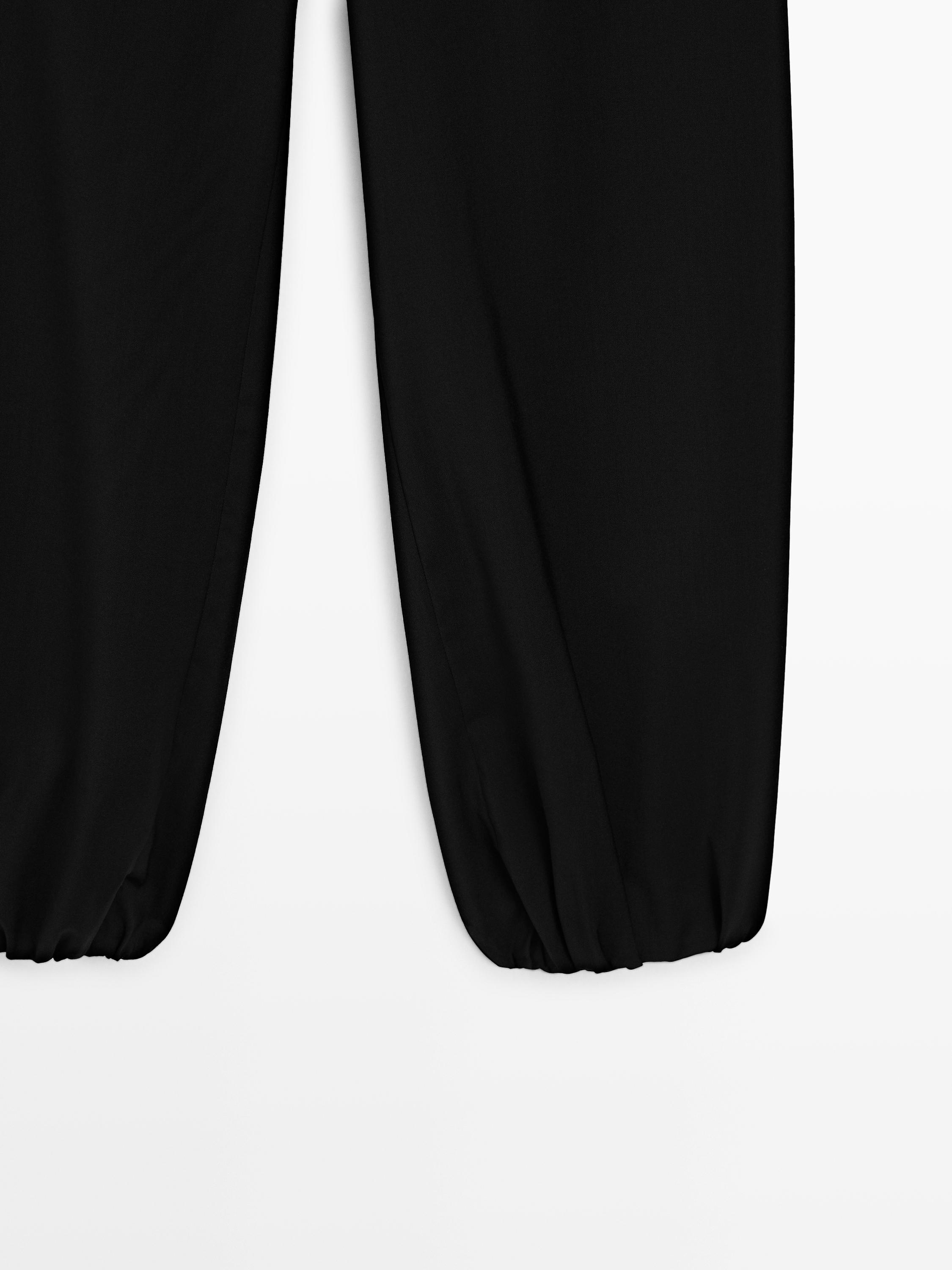 Wool sarouel trousers with tie detail — BLACK