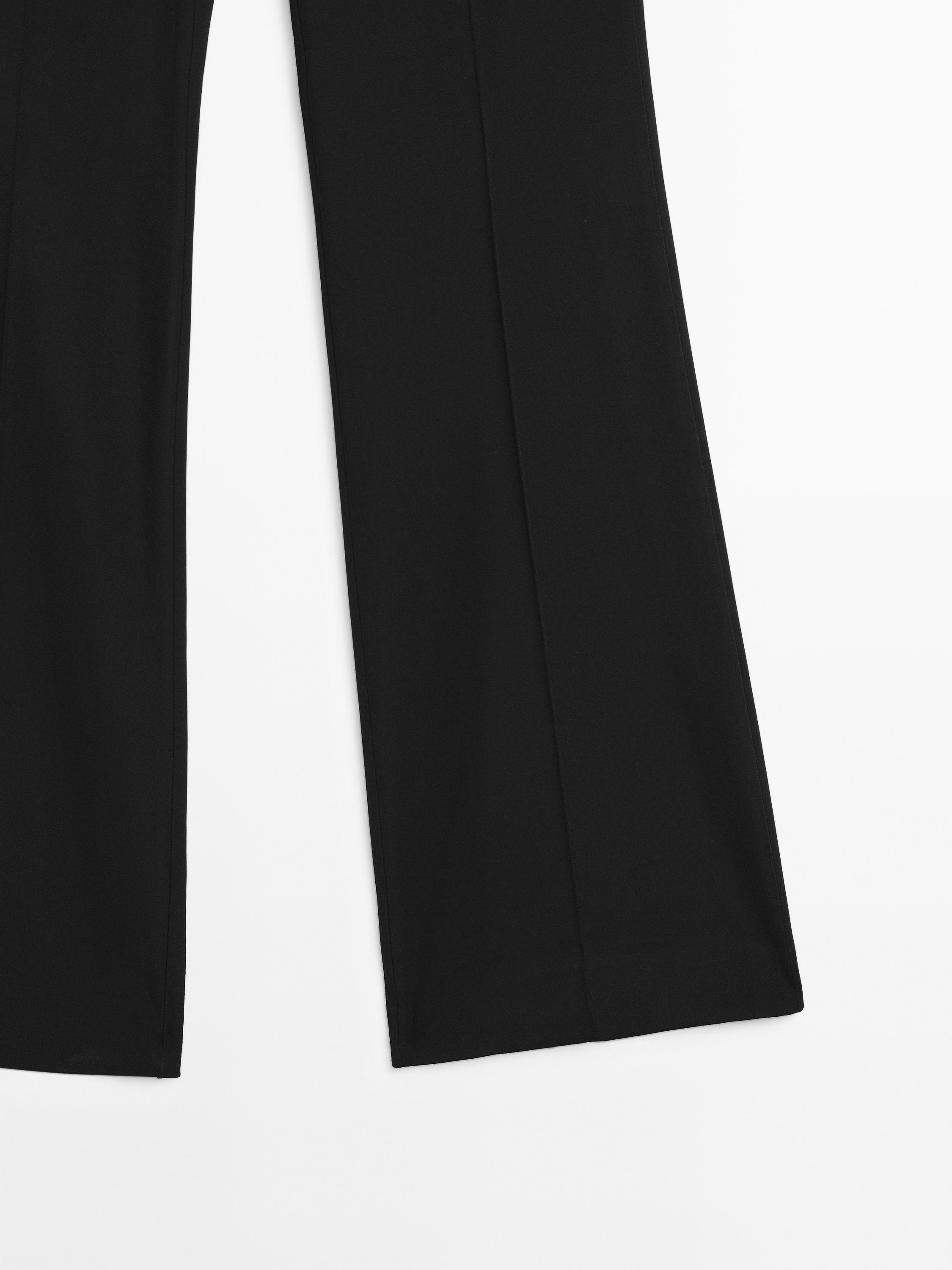 Flared trousers with pocket — BLACK