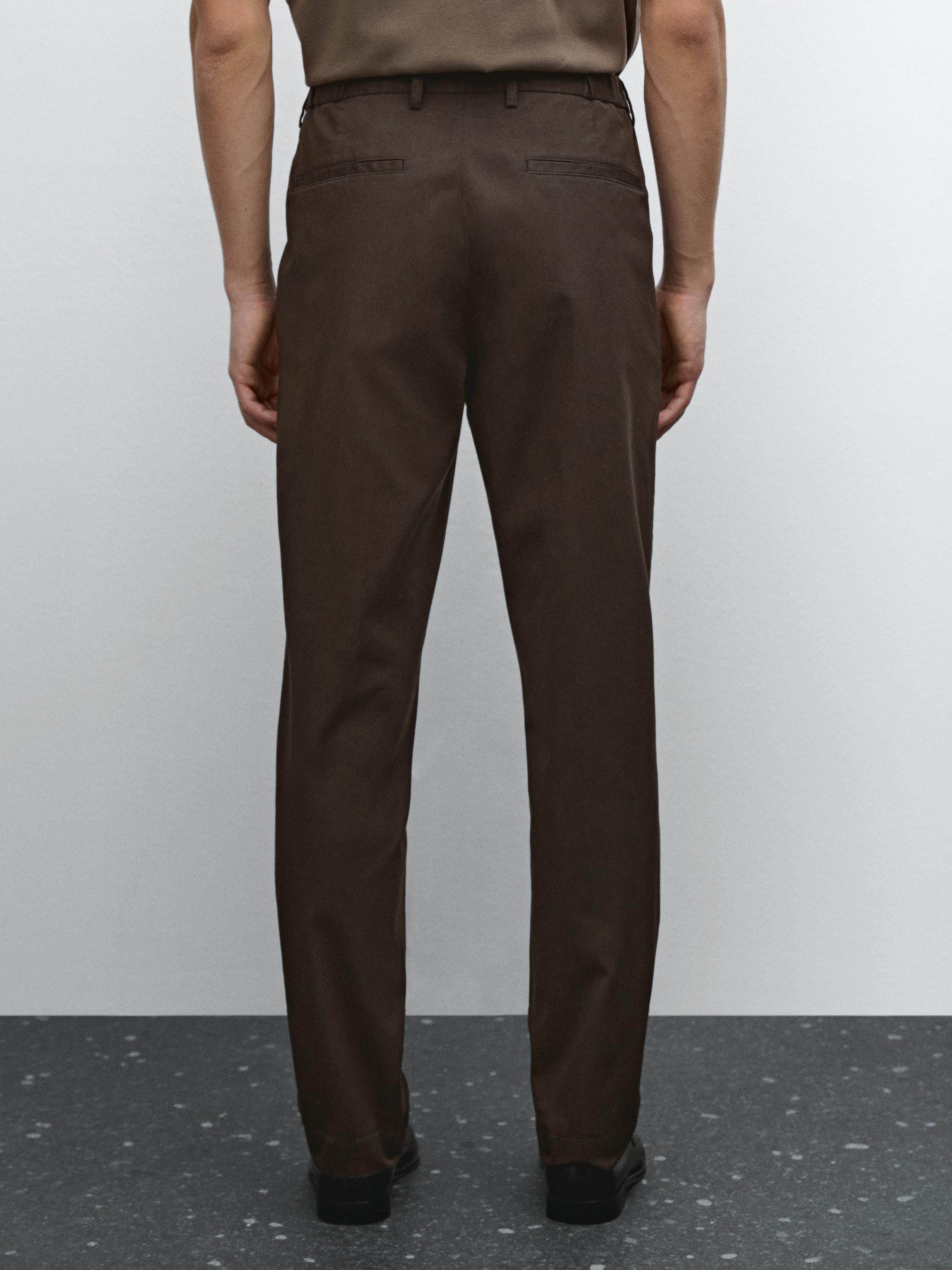 Pantalon tapered élastique sur le côté