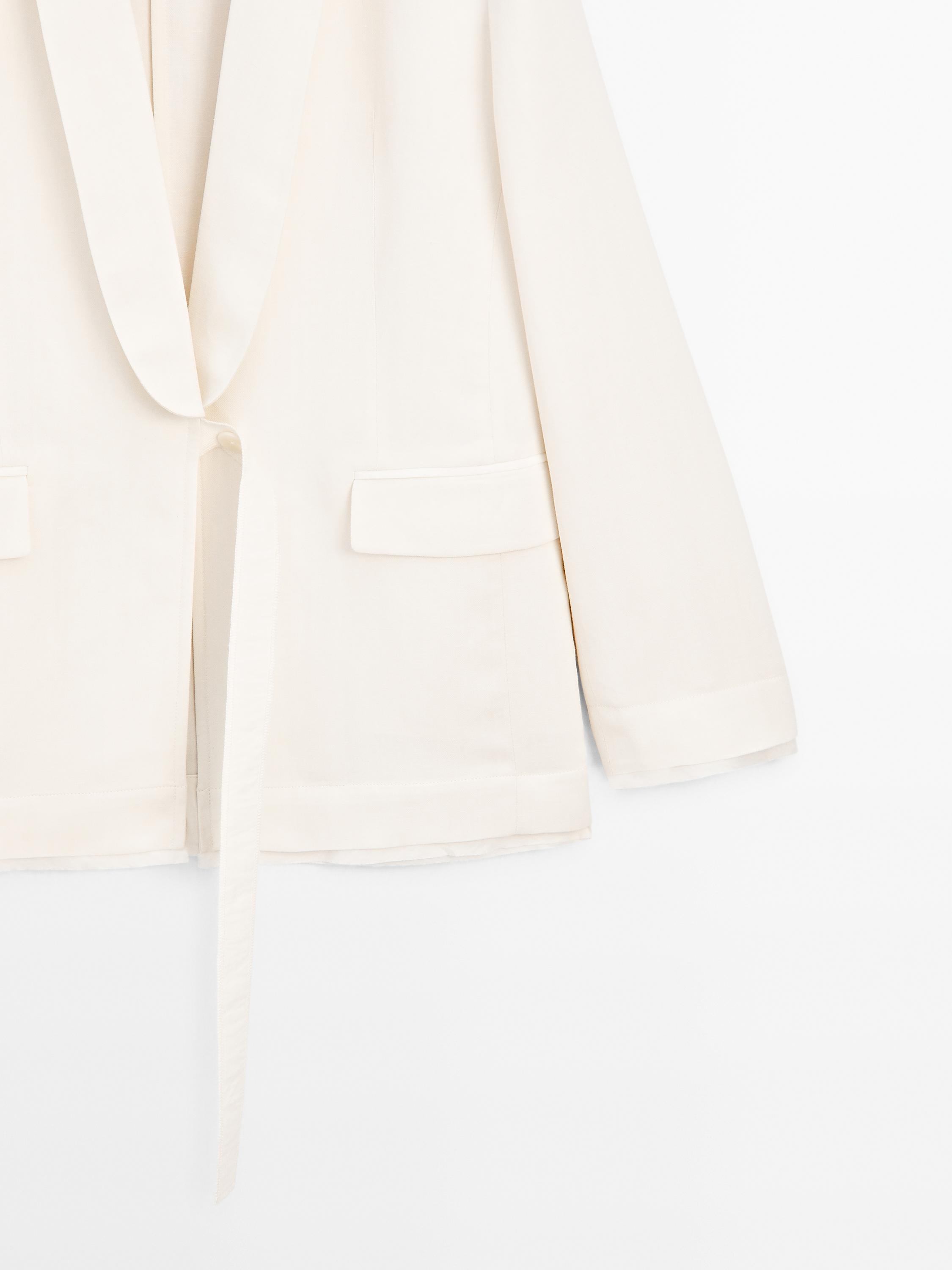 Suit blazer with tie detail in contrast fabric