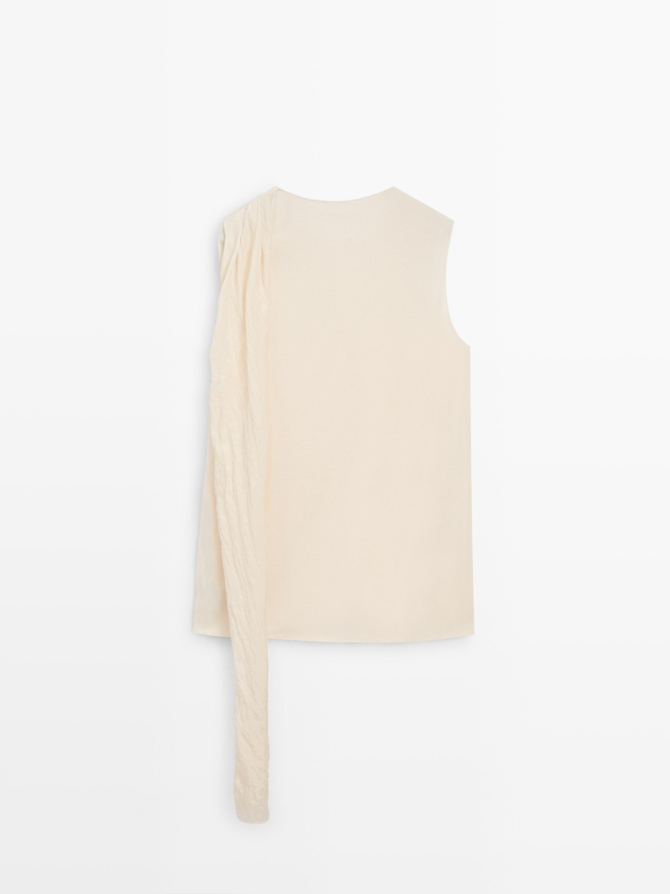 Cross-over top with scarf detail on the shoulder