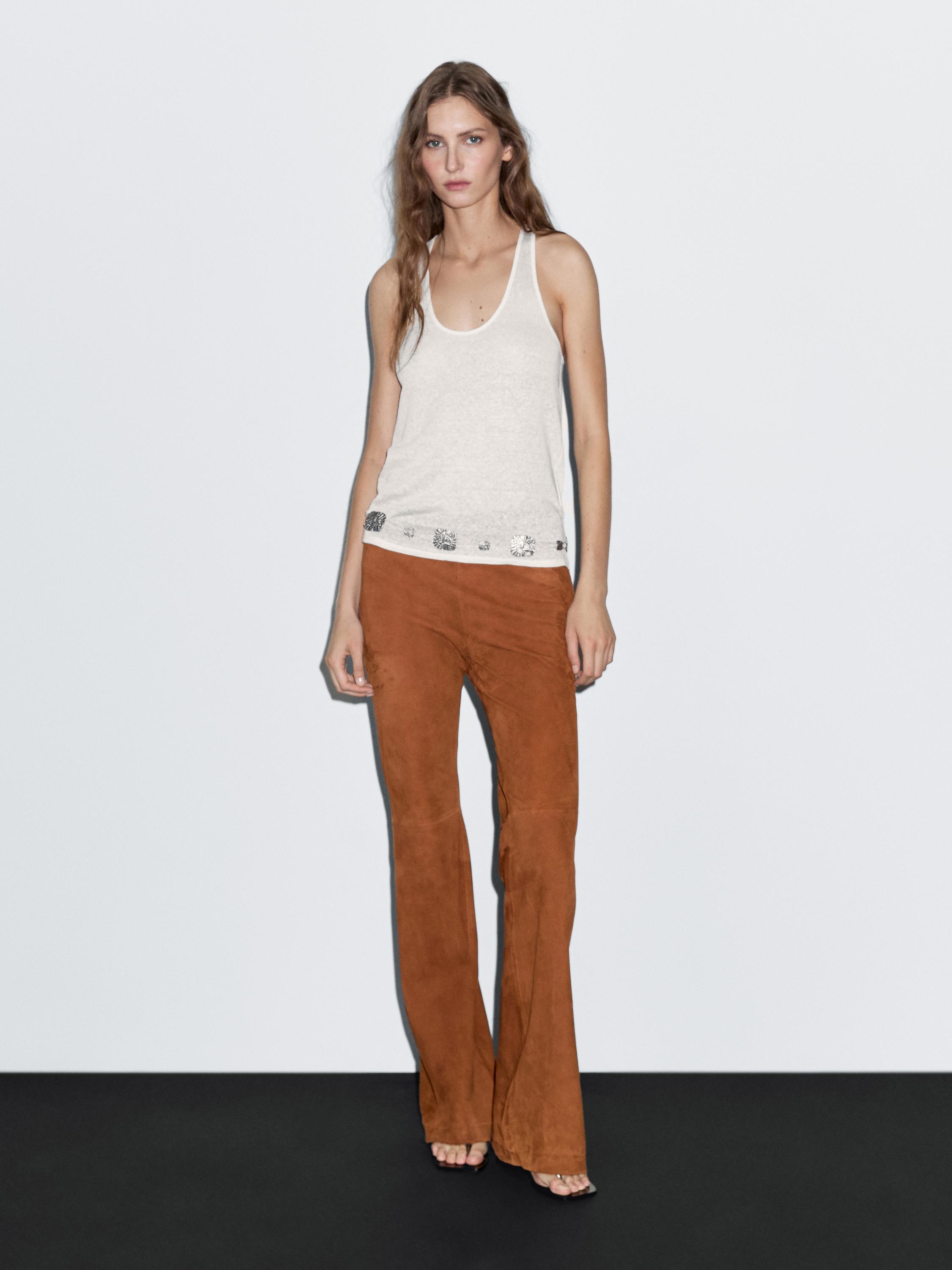 Pantalon flare en cuir finition daim